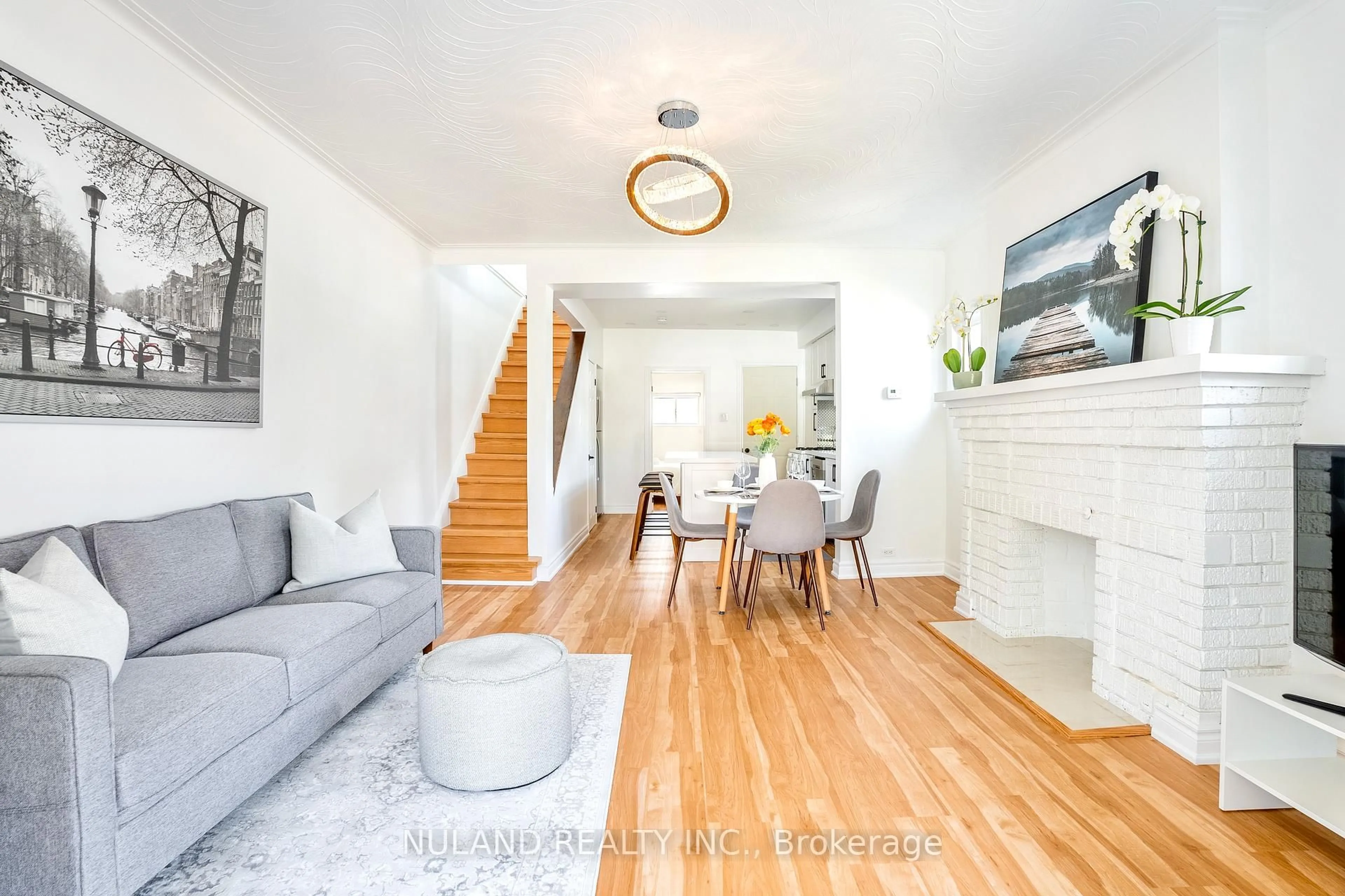 Living room with furniture, wood/laminate floor for 56 Blandford St, Toronto Ontario M6E 3A7