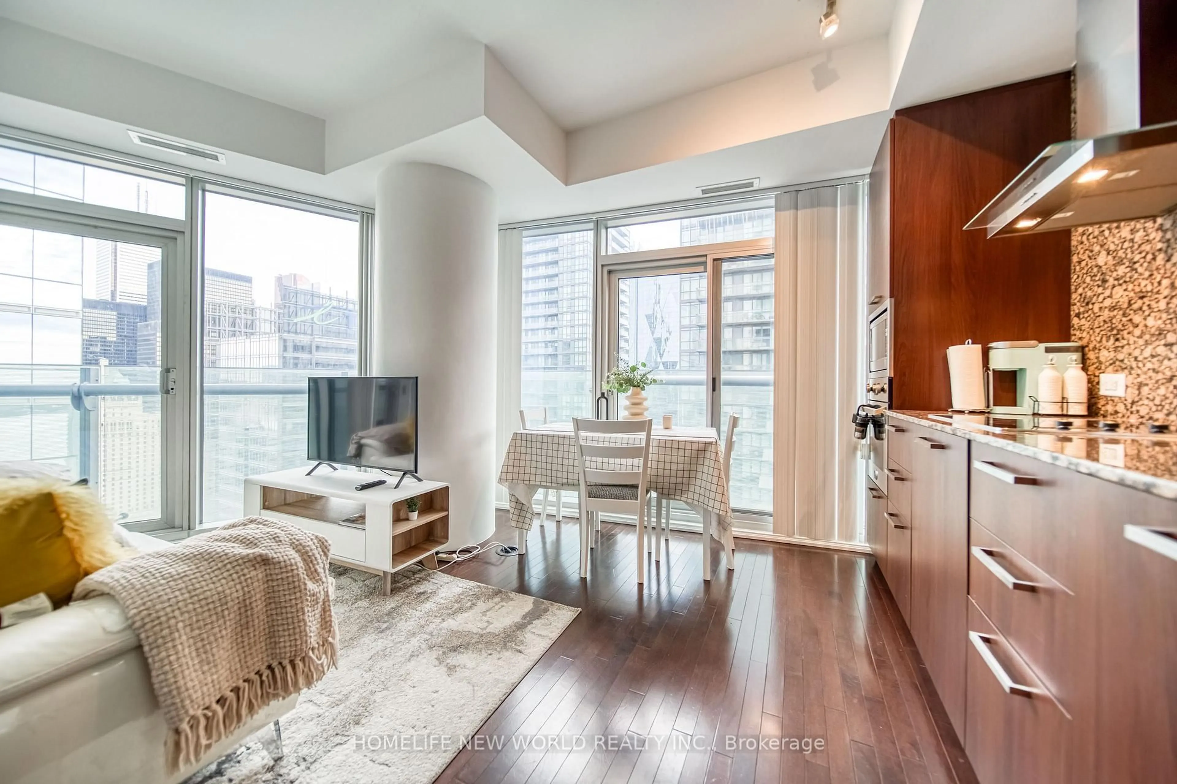 Living room with furniture, wood/laminate floor for 14 York St #3411, Toronto Ontario M5J 0B1