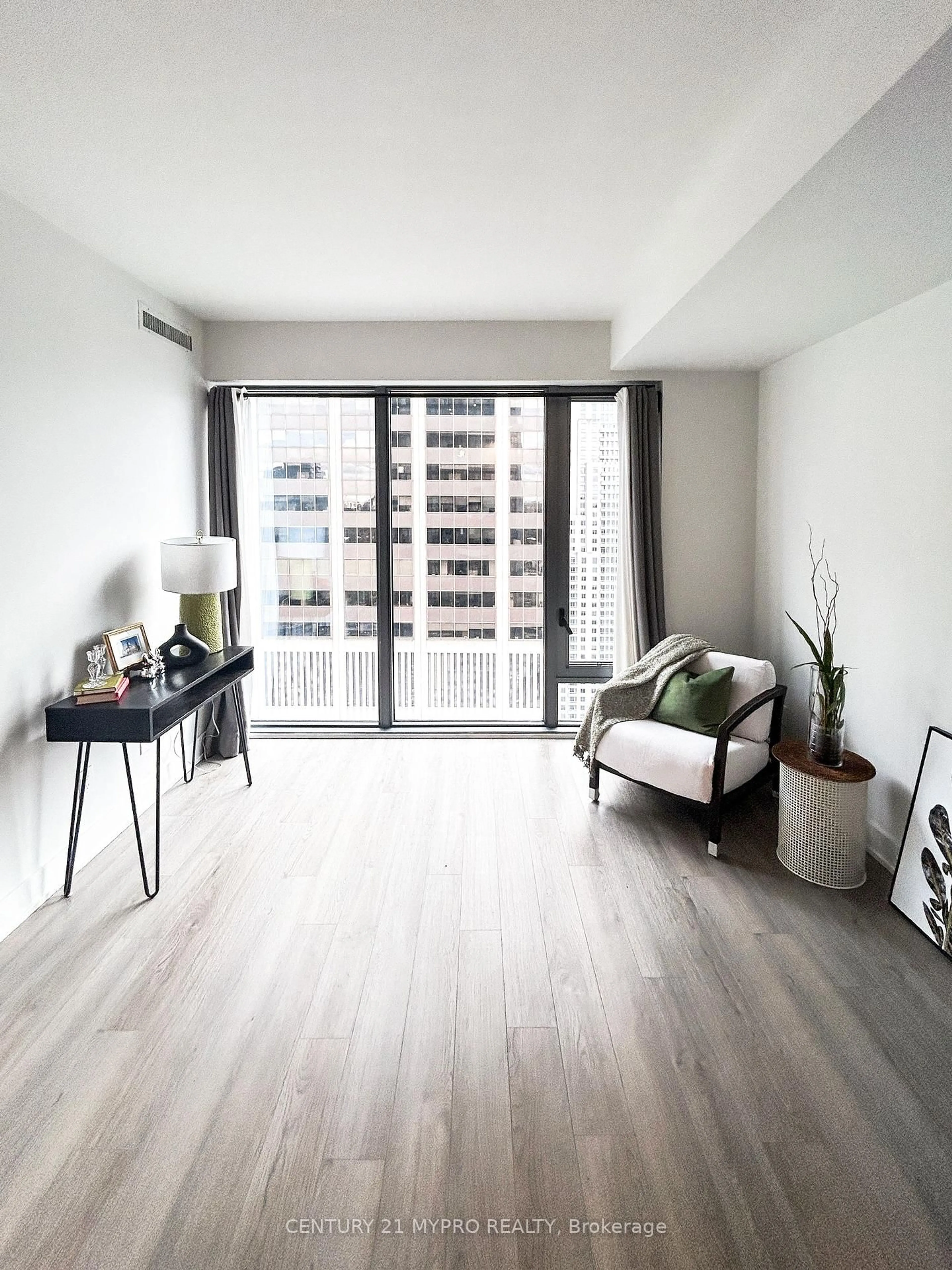 Living room with furniture, wood/laminate floor for 8 Cumberland St #3104, Toronto Ontario M4W 0B6