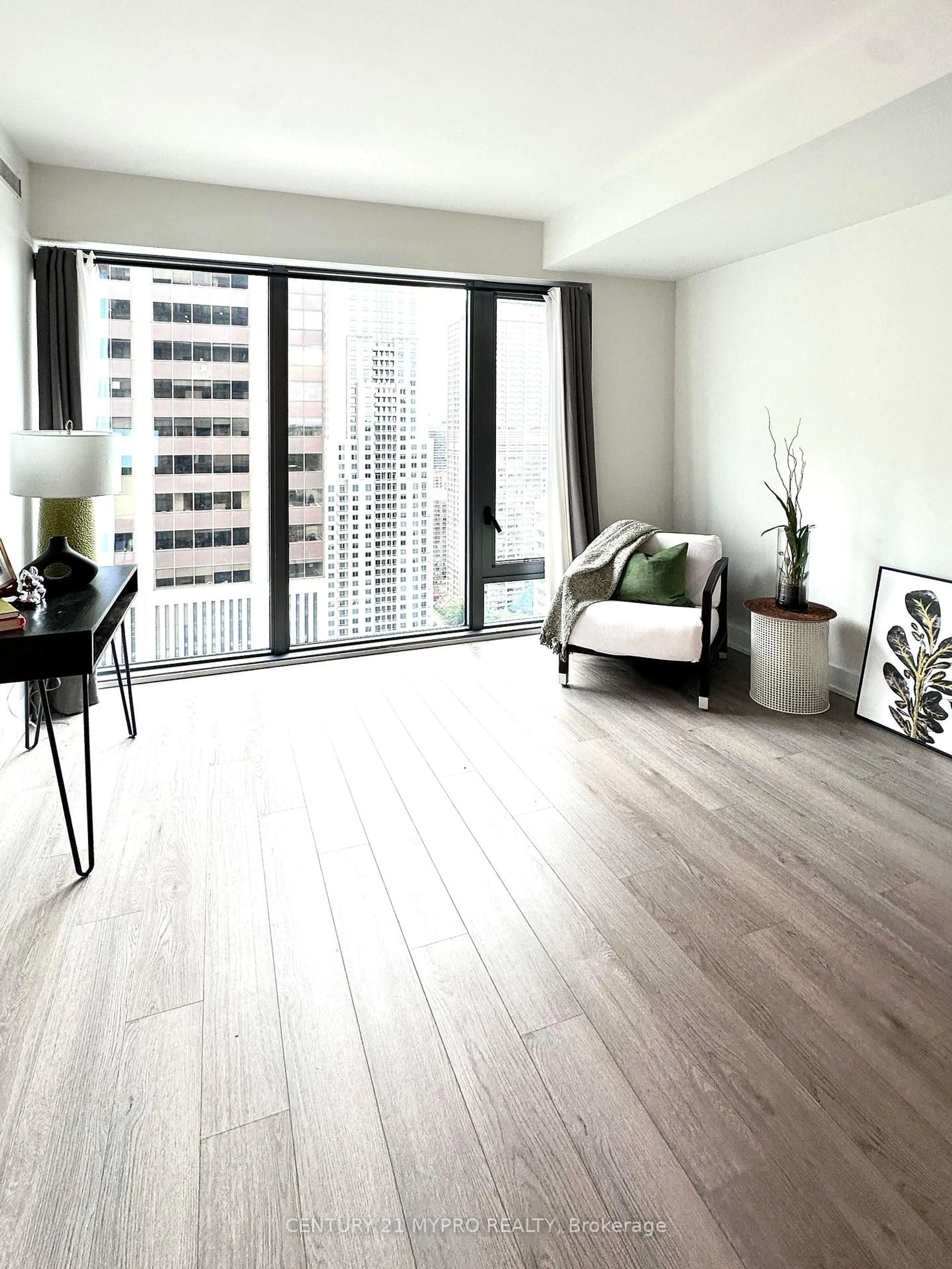 Living room with furniture, wood/laminate floor for 8 Cumberland St #3104, Toronto Ontario M4W 0B6