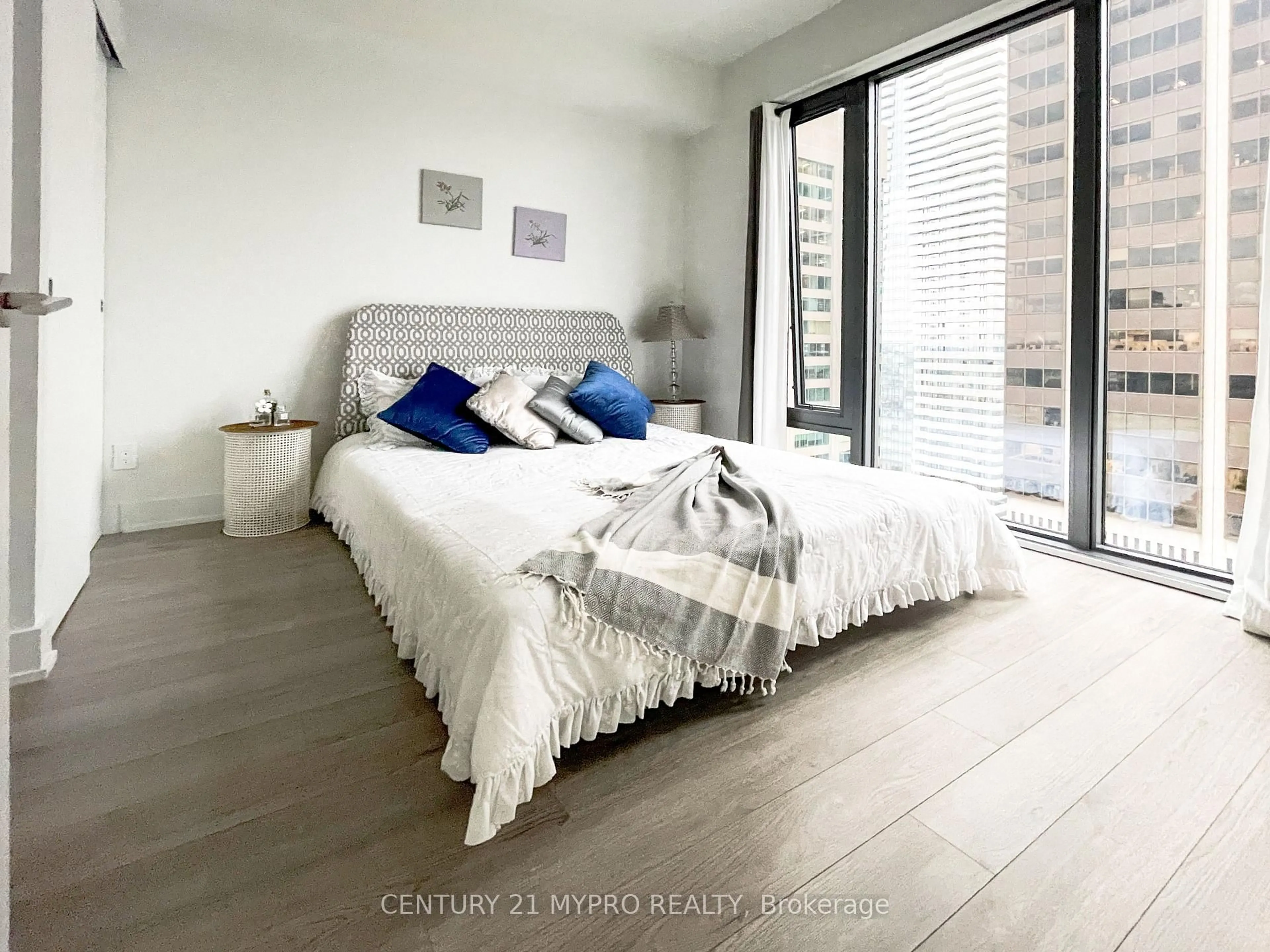 Bedroom with bed, wood/laminate floor for 8 Cumberland St #3104, Toronto Ontario M4W 0B6