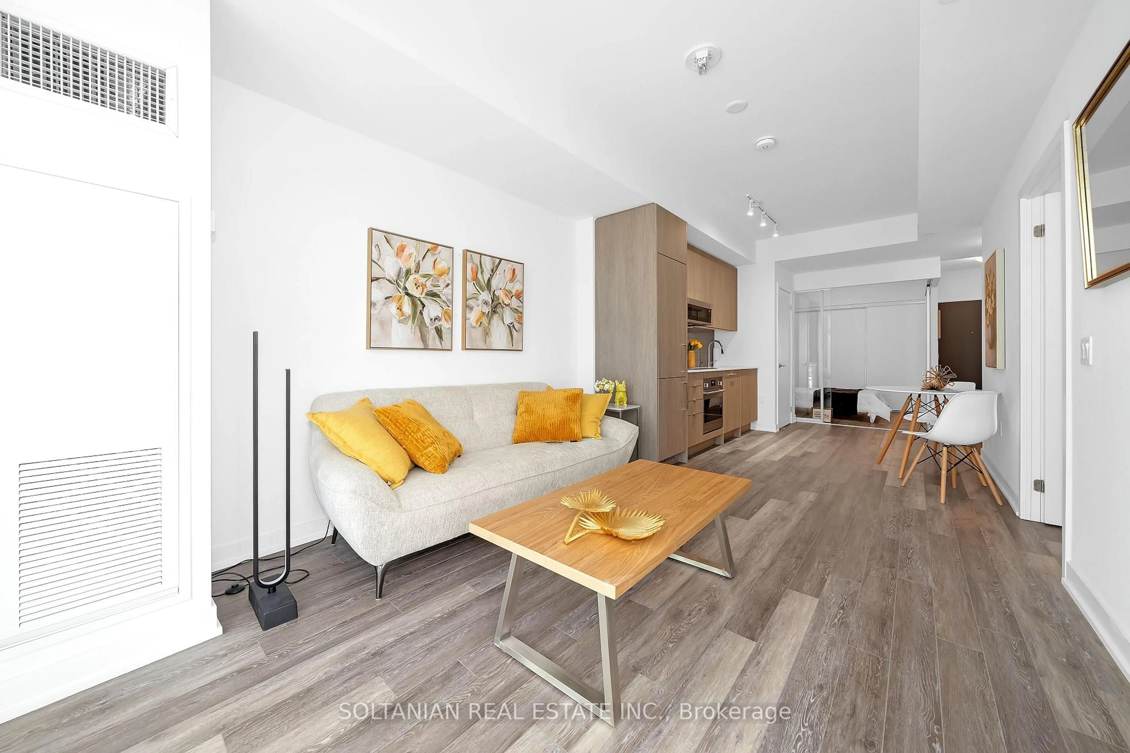 Living room with furniture, wood/laminate floor for 250 Lawrence Ave #320, Toronto Ontario M5M 1B1