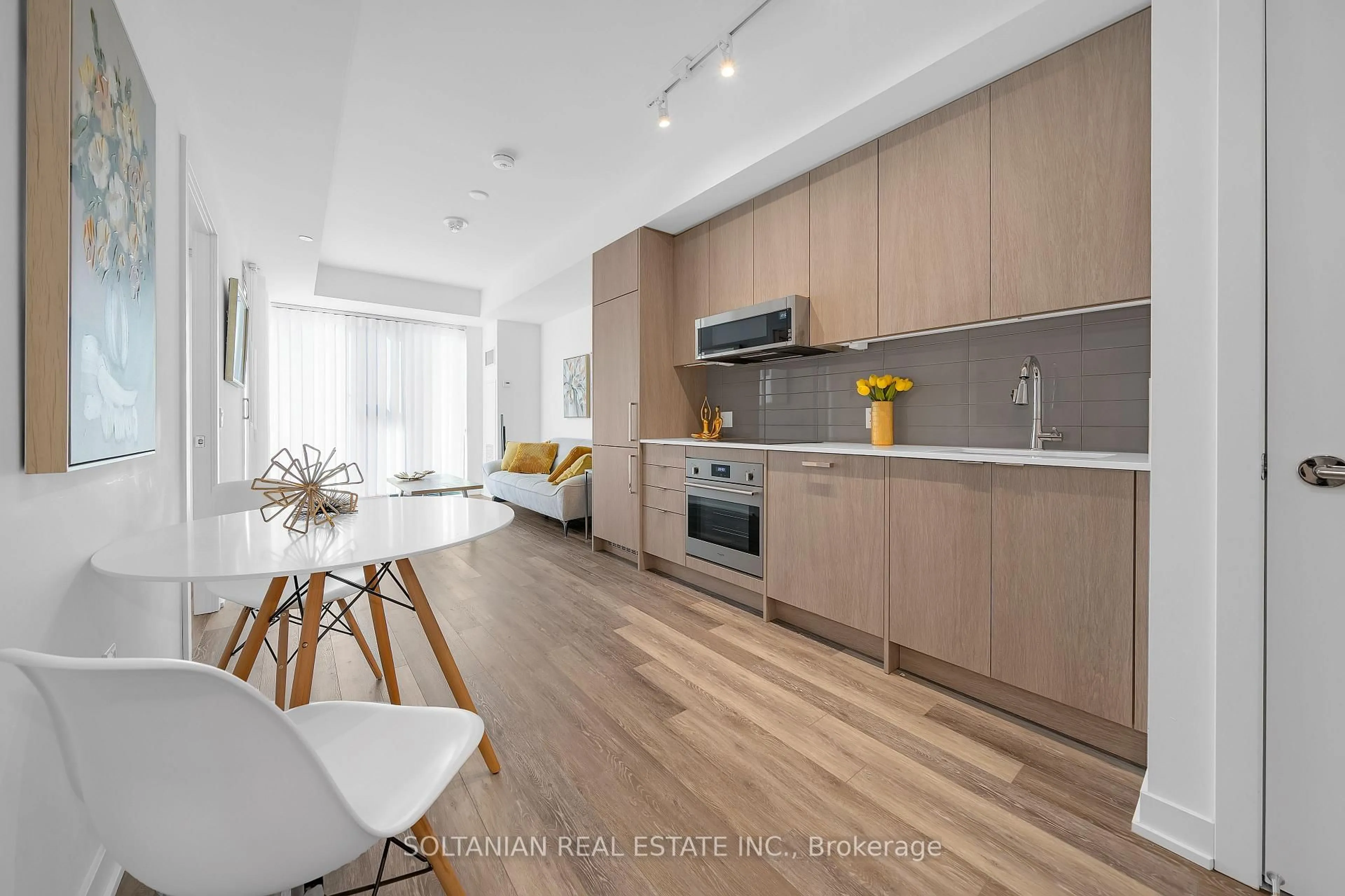 Open concept kitchen, wood/laminate floor for 250 Lawrence Ave #320, Toronto Ontario M5M 1B1