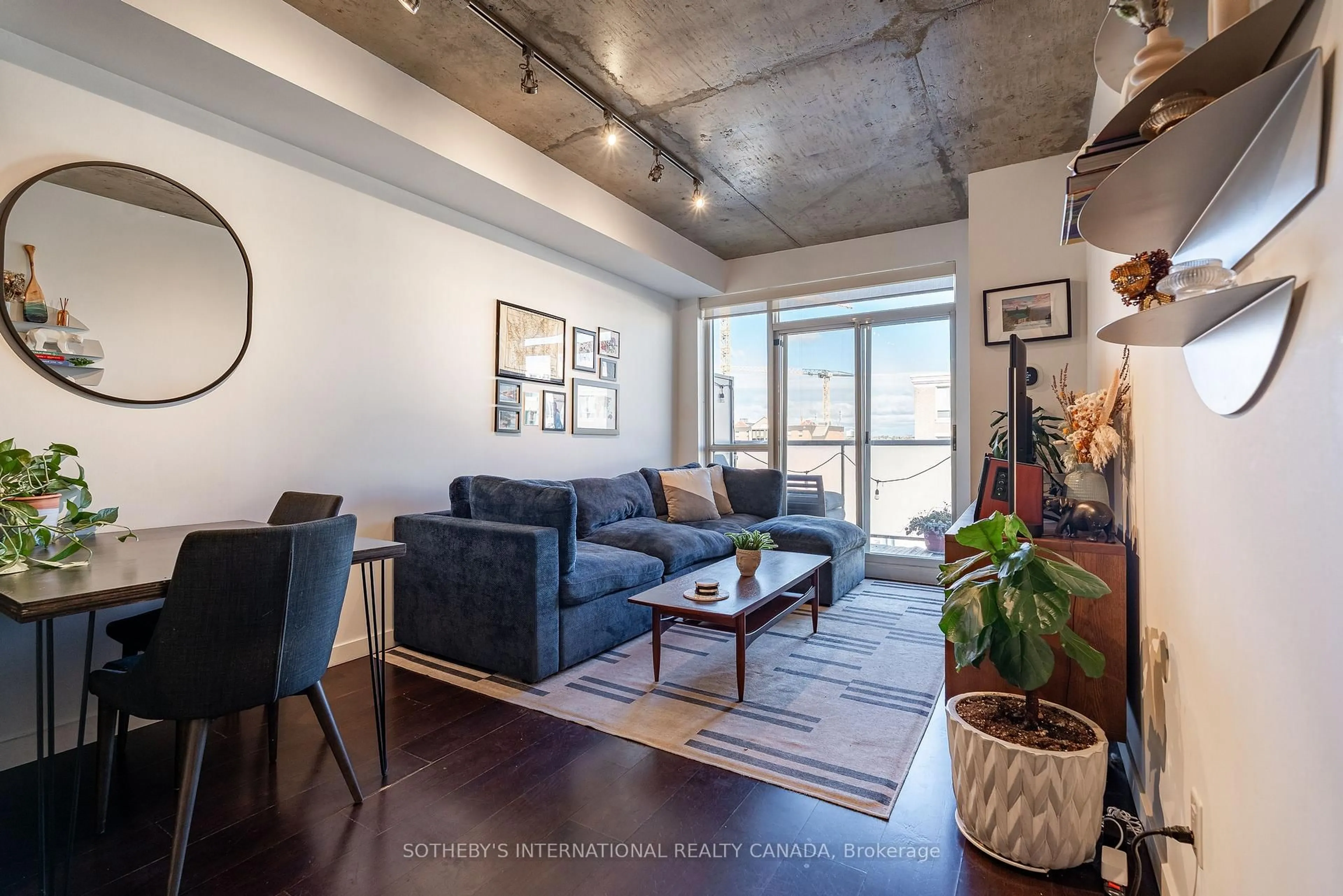 Living room with furniture, cement floor for 1005 King St #810, Toronto Ontario M6K 3M8