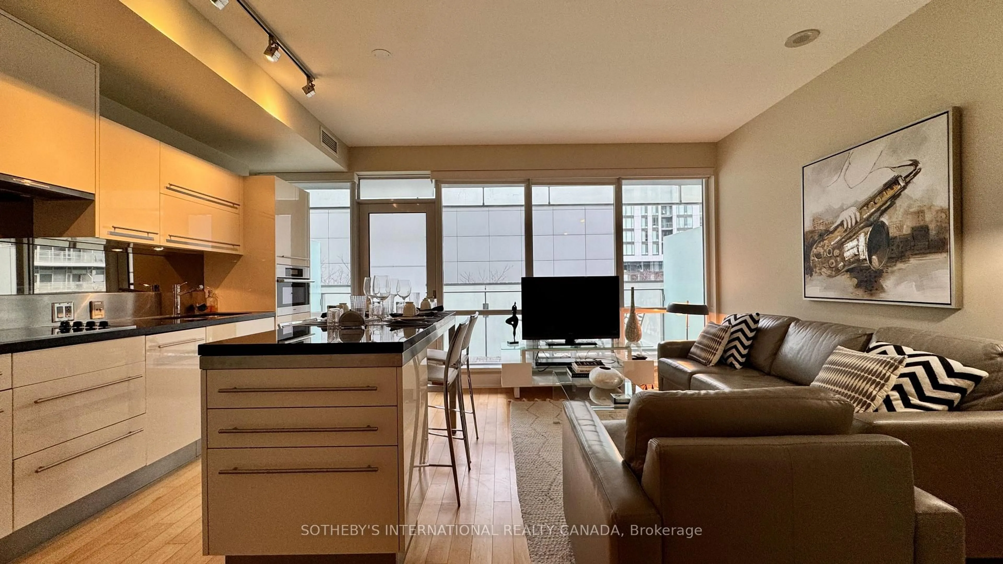 Living room with furniture, wood/laminate floor for 80 John St #1205, Toronto Ontario M5V 3X4