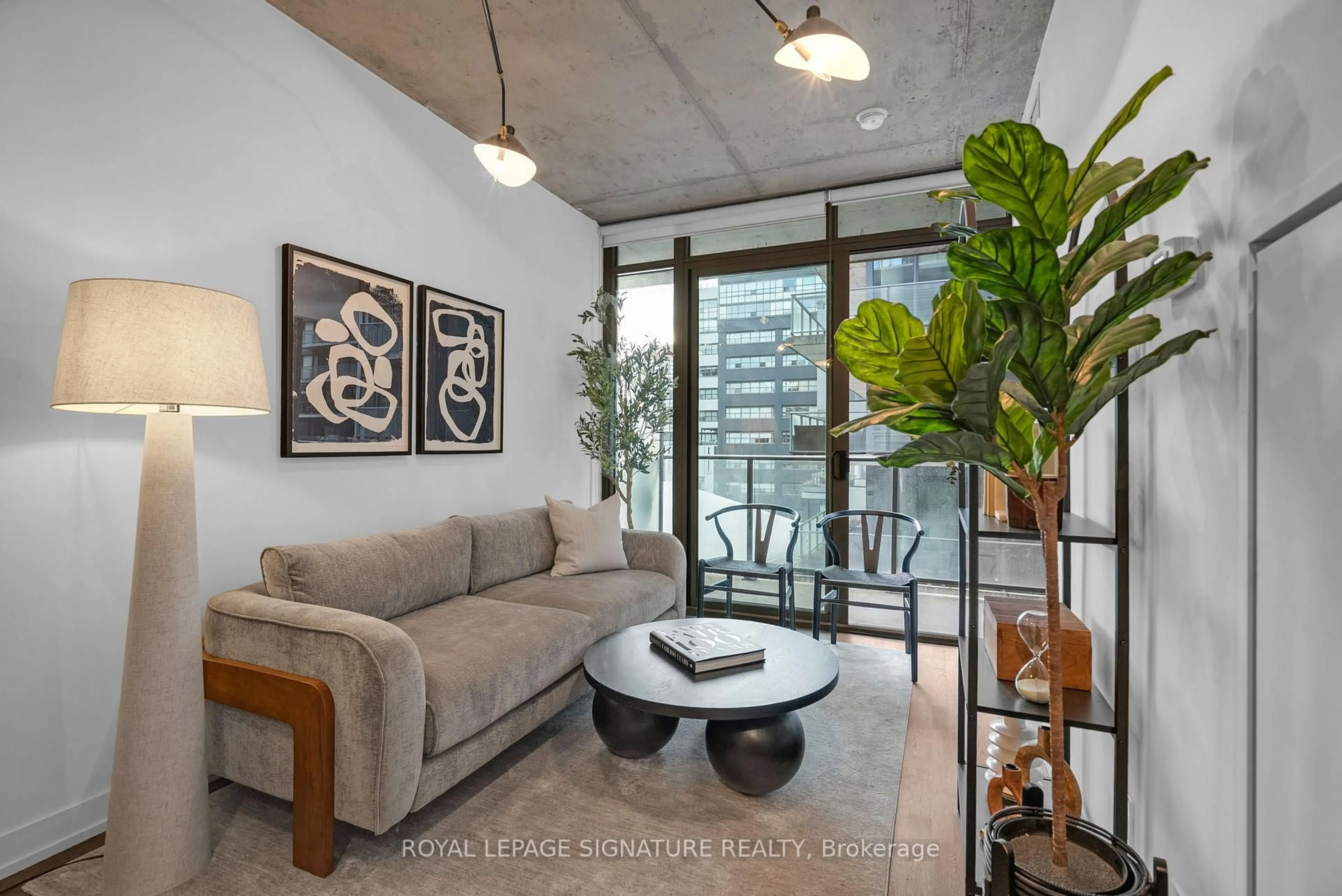 Living room with furniture, cement floor for 650 King St #804, Toronto Ontario M5V 0H6