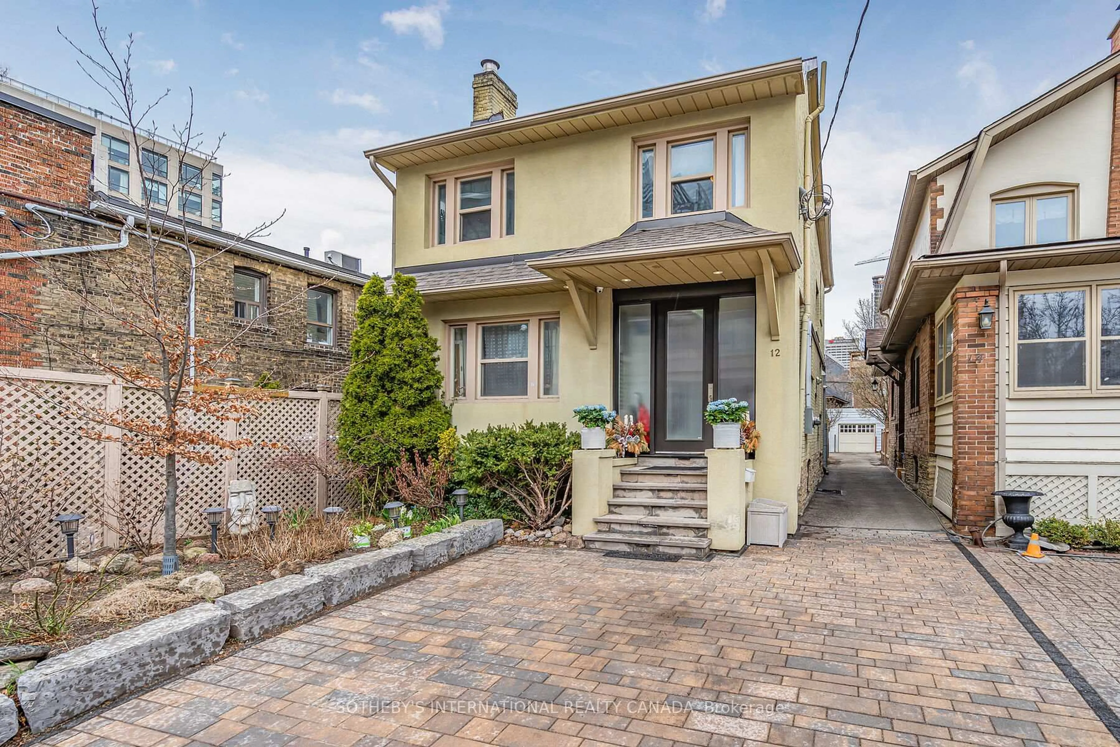 Home with brick exterior material, street for 12 Belsize Dr, Toronto Ontario M4S 1L4