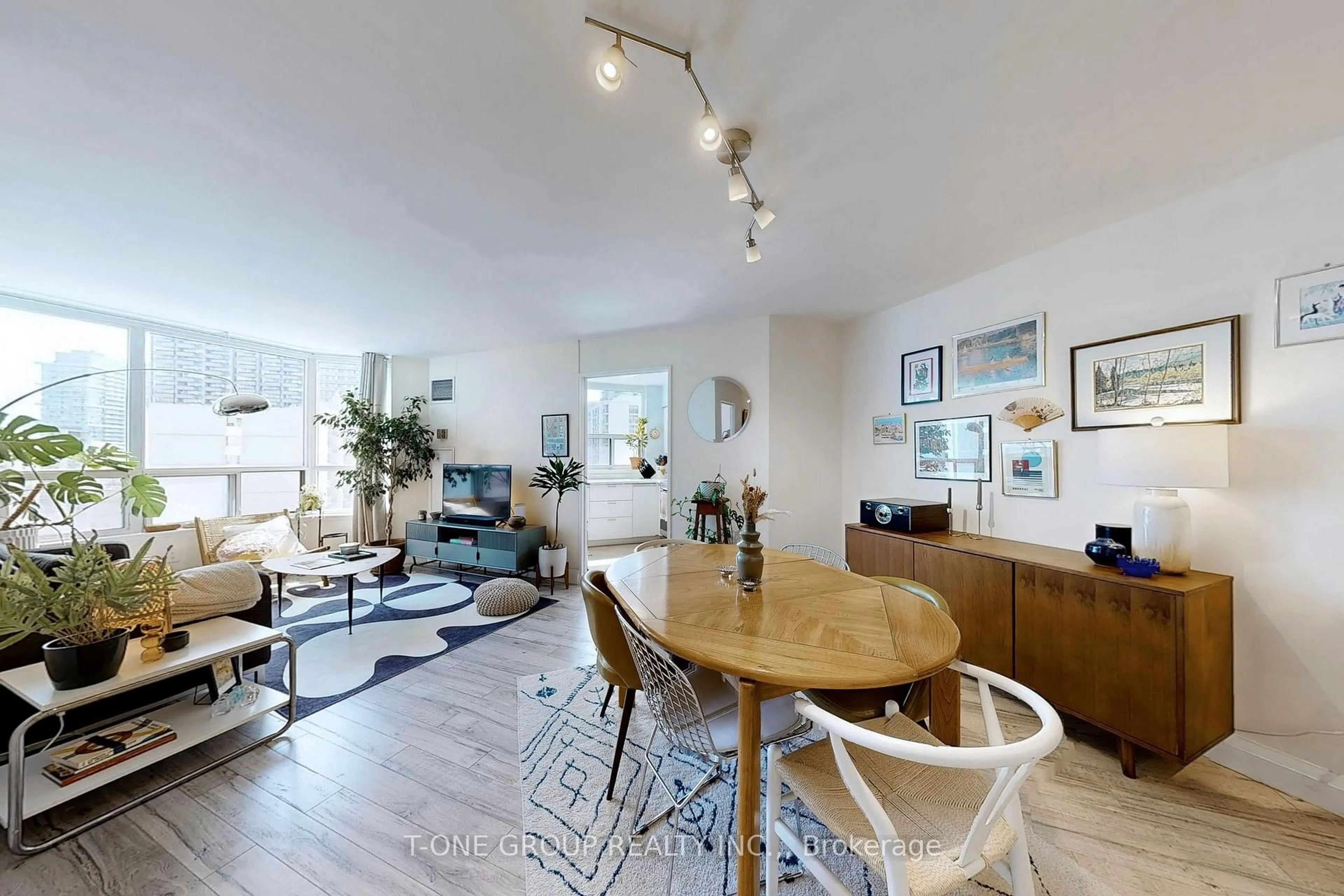 Living room with furniture, wood/laminate floor for 25 Maitland St #1212, Toronto Ontario M4Y 2W1