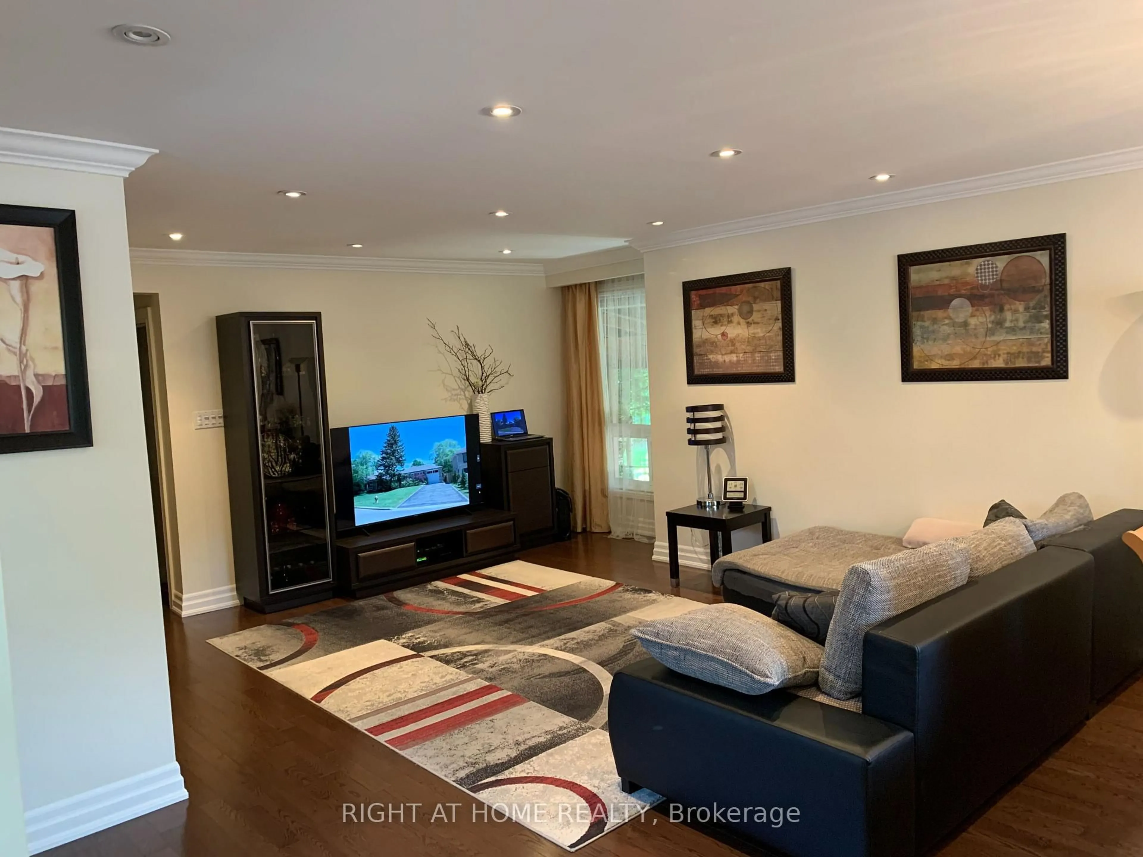 Living room with furniture, wood/laminate floor for 66 Dewlane Dr, Toronto Ontario M2R 2P8