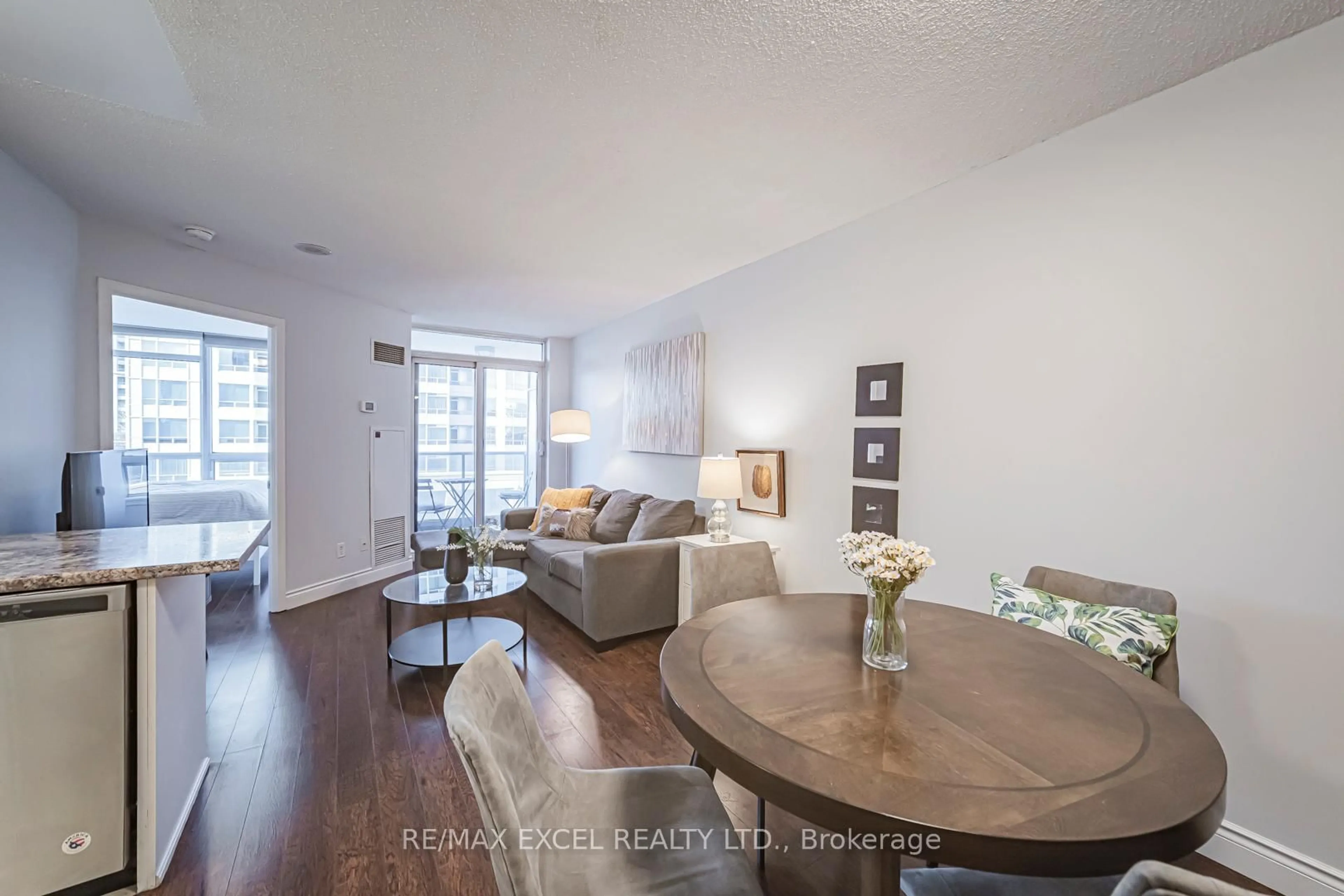 Living room with furniture, wood/laminate floor for 8 Rean Dr #413, Toronto Ontario M2K 3B9
