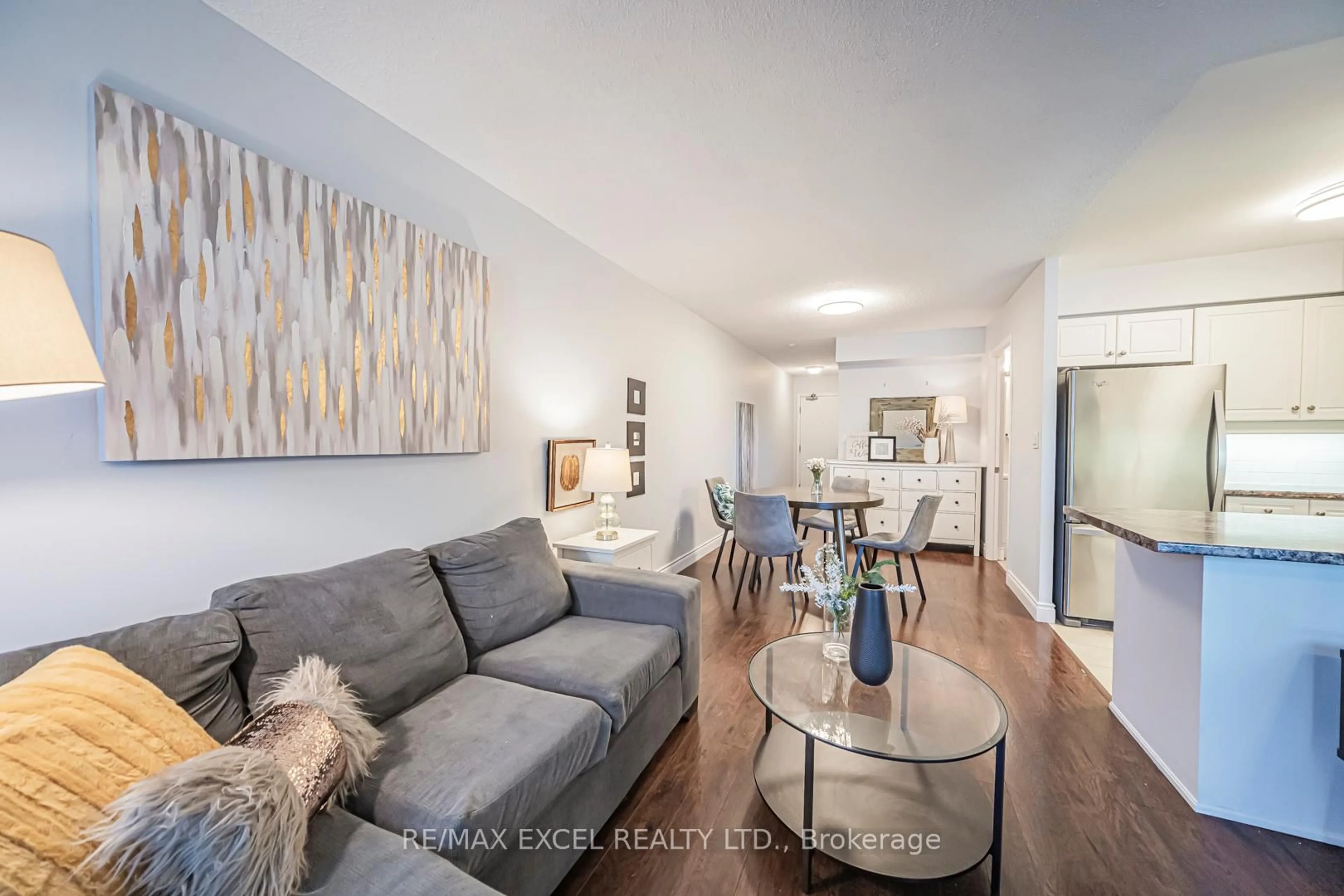 Living room with furniture, wood/laminate floor for 8 Rean Dr #413, Toronto Ontario M2K 3B9