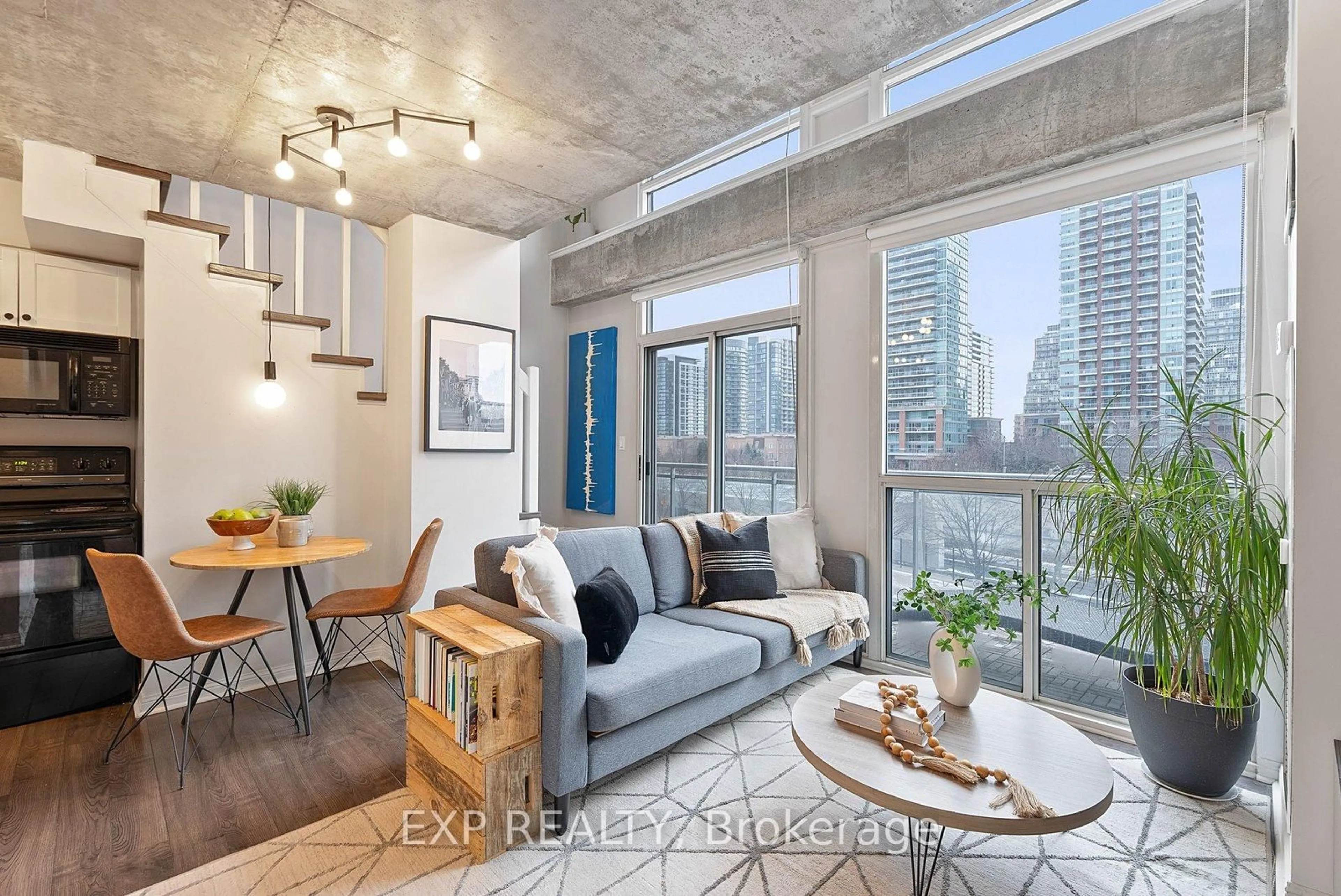 Living room with furniture, cement floor for 1029 King St #401, Toronto Ontario M6K 1J7