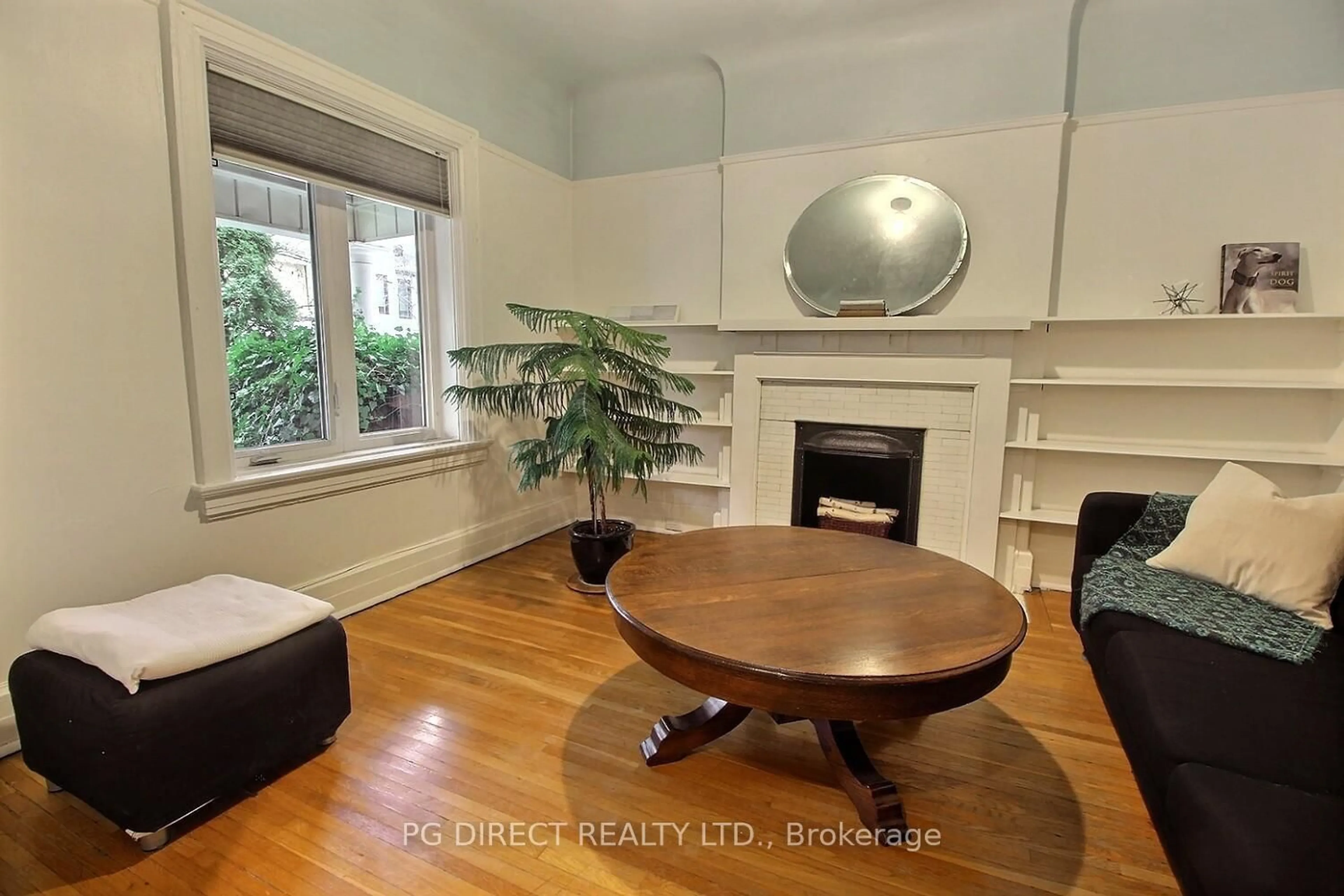 Living room with furniture, wood/laminate floor for 62 Moutray St, Toronto Ontario M6K 1W5
