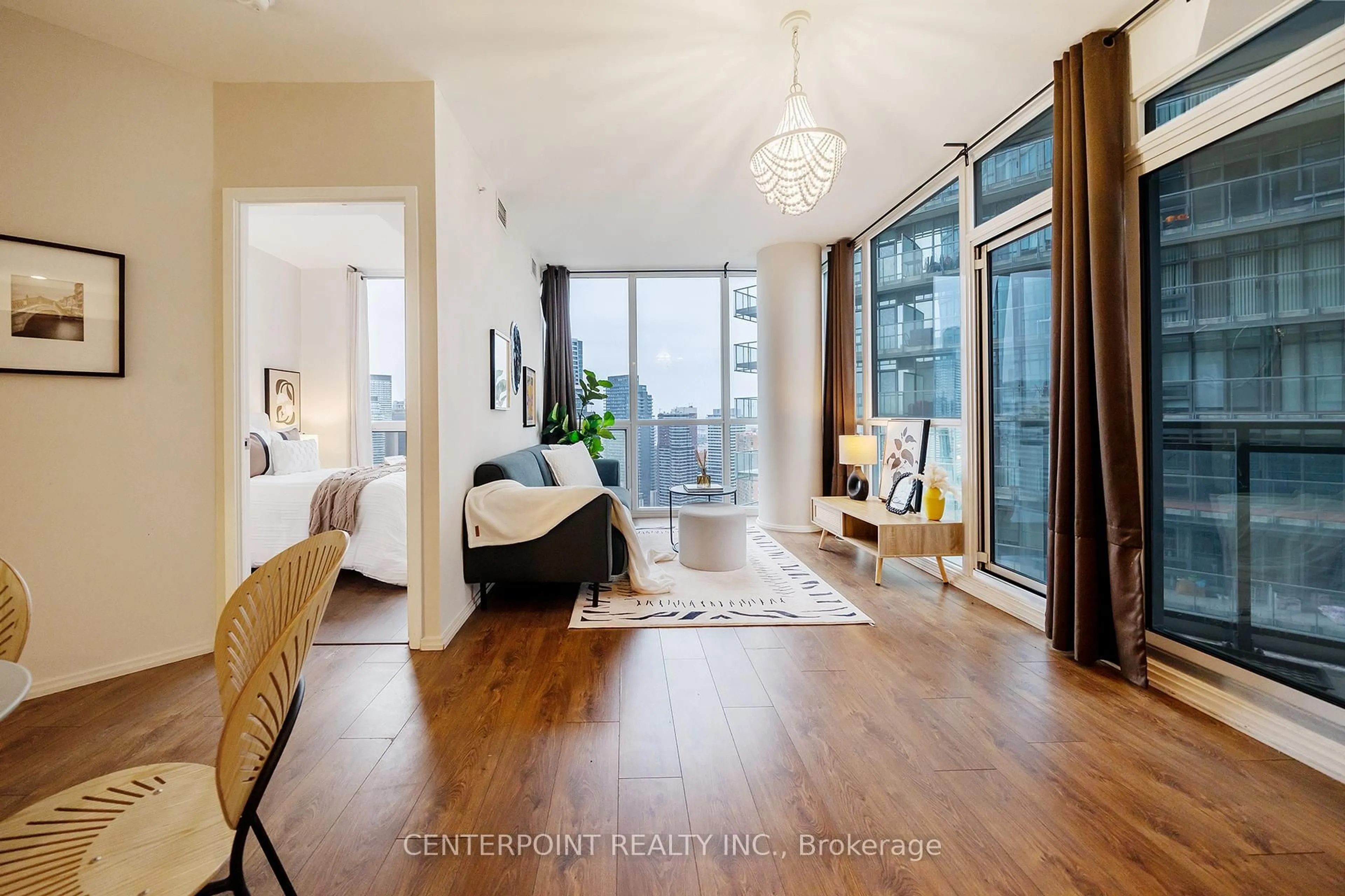 Living room with furniture, wood/laminate floor for 45 Charles St #3602, Toronto Ontario M4Y 1S2