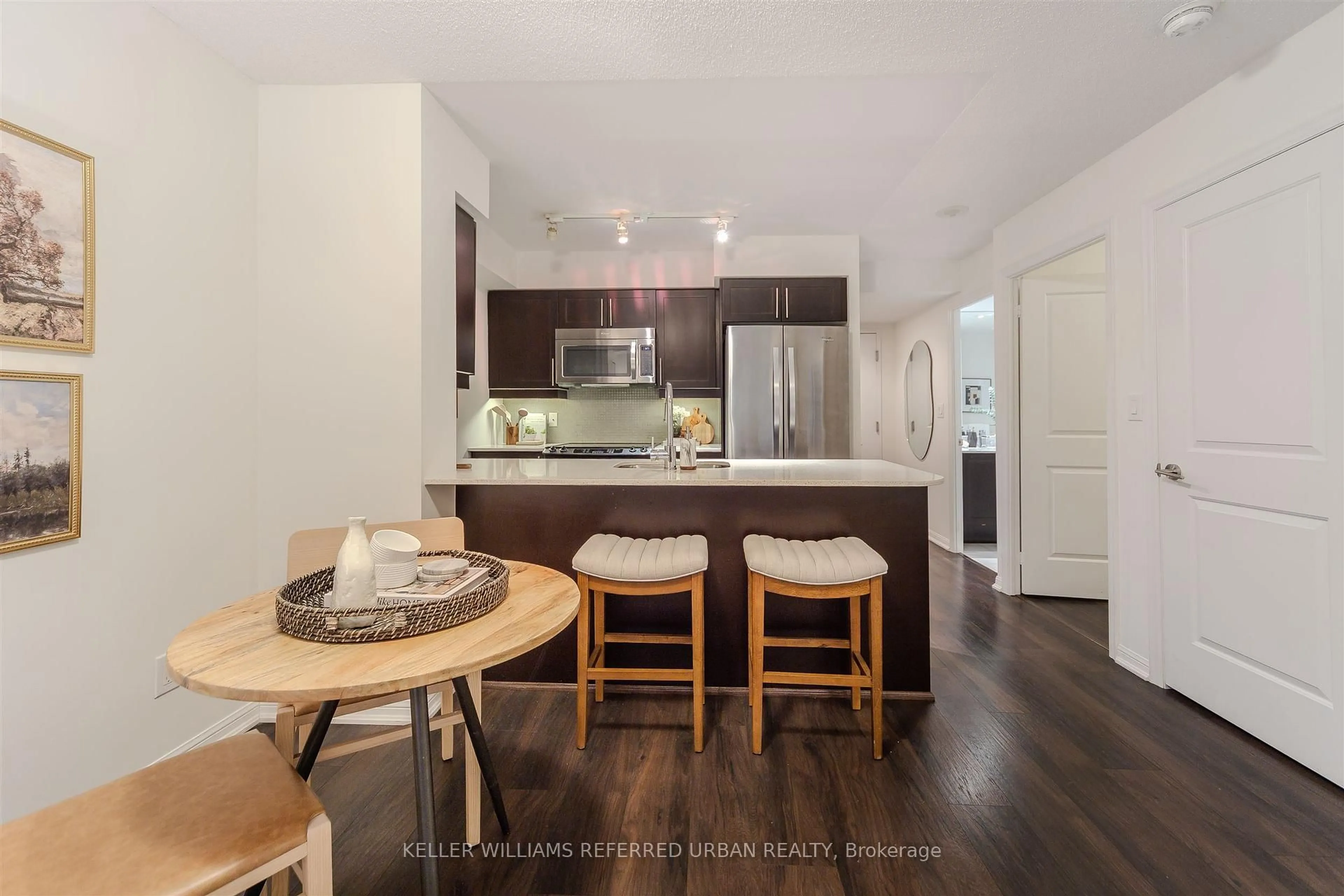 Open concept kitchen, wood/laminate floor for 38 Grand Magazine St #744, Toronto Ontario M5V 0B2
