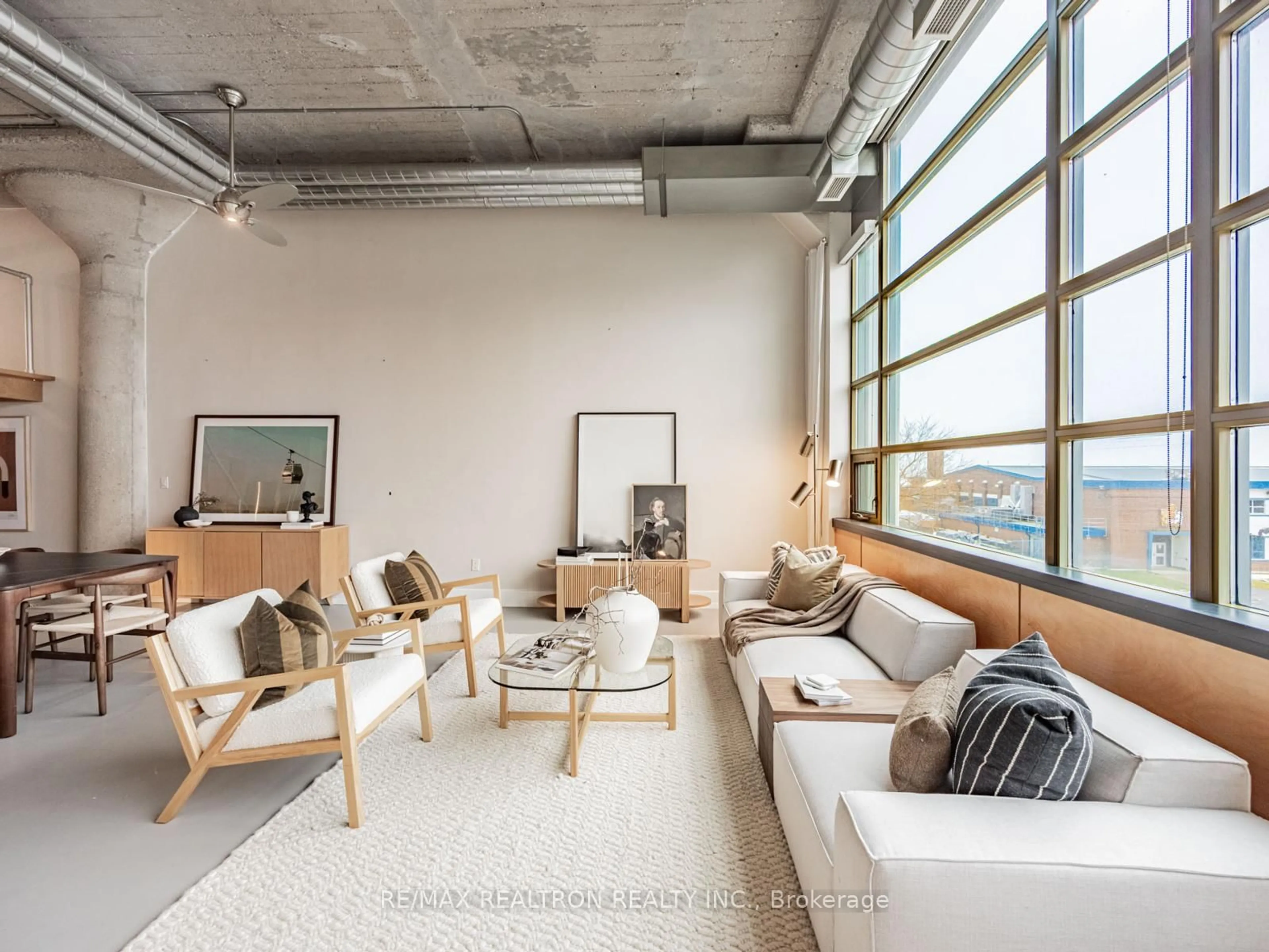 Living room with furniture, cement floor for 637 Lake Shore Blvd #208, Toronto Ontario M5V 3J6