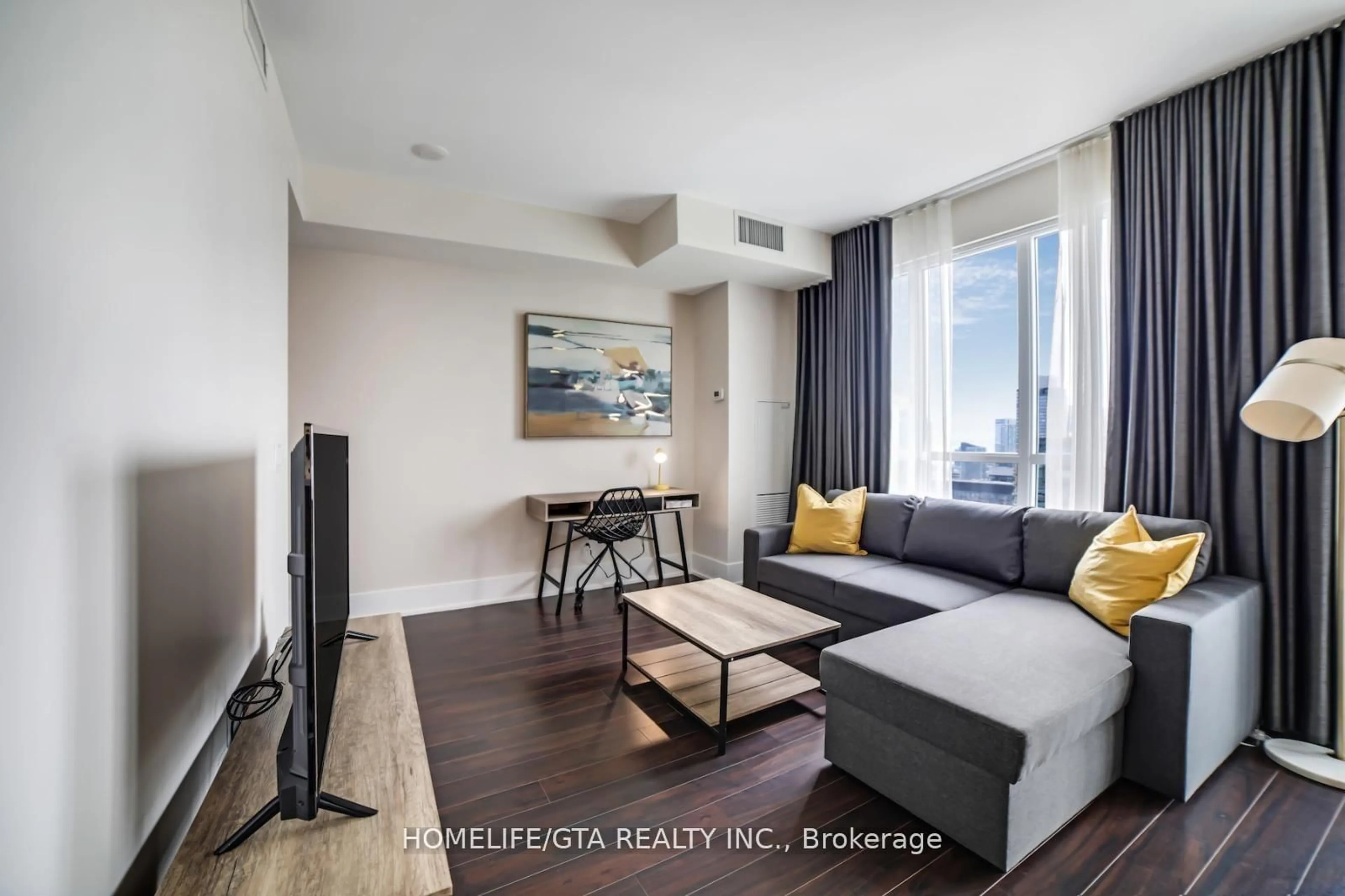 Living room with furniture, wood/laminate floor for 300 Front St #3214, Toronto Ontario M5V 0E9