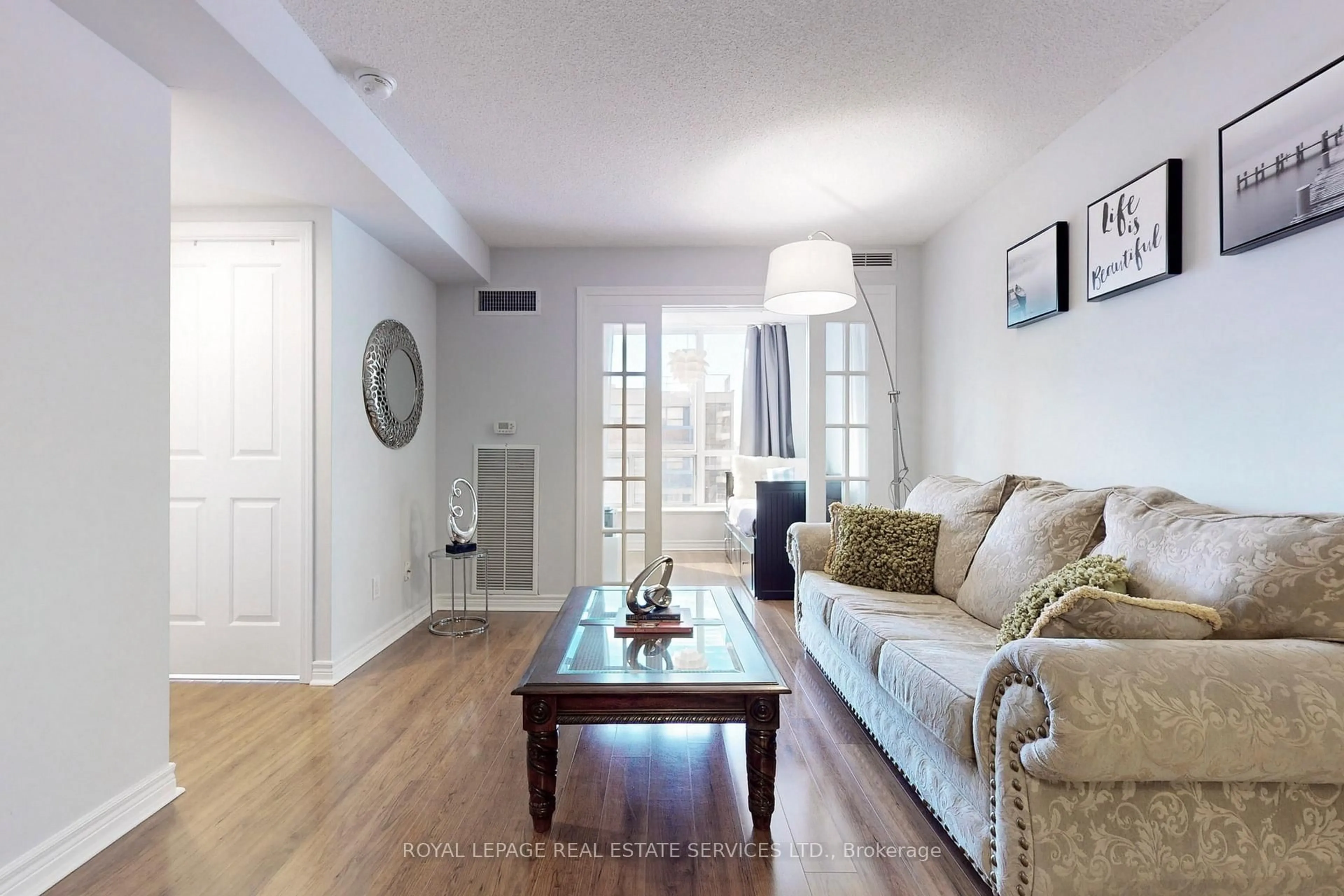 Living room with furniture, wood/laminate floor for 152 St Patrick St #901, Toronto Ontario M5T 3J9