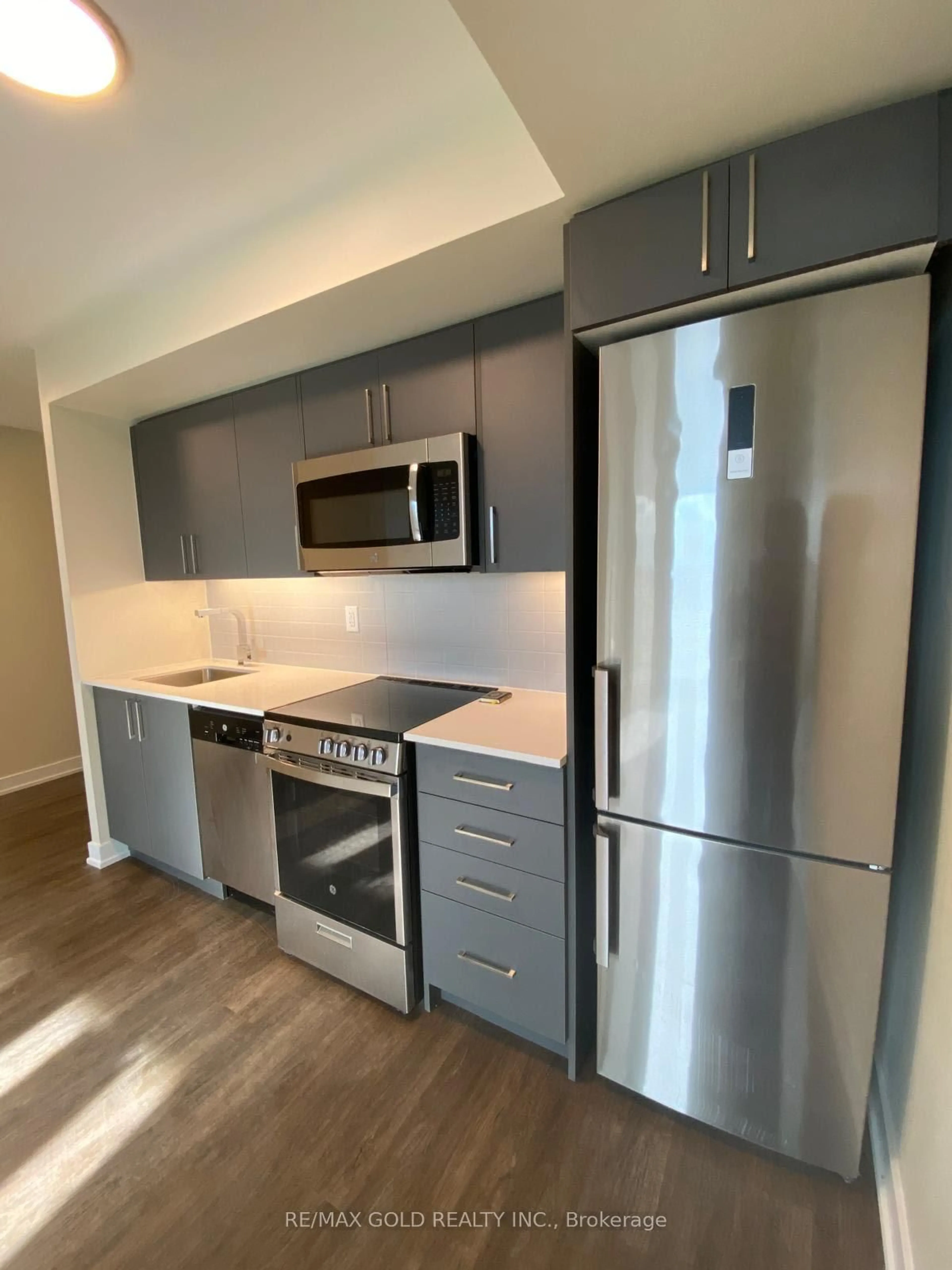 Standard kitchen, wood/laminate floor for 38 Monte Kwinter Crt #515, Toronto Ontario M3H 0E2
