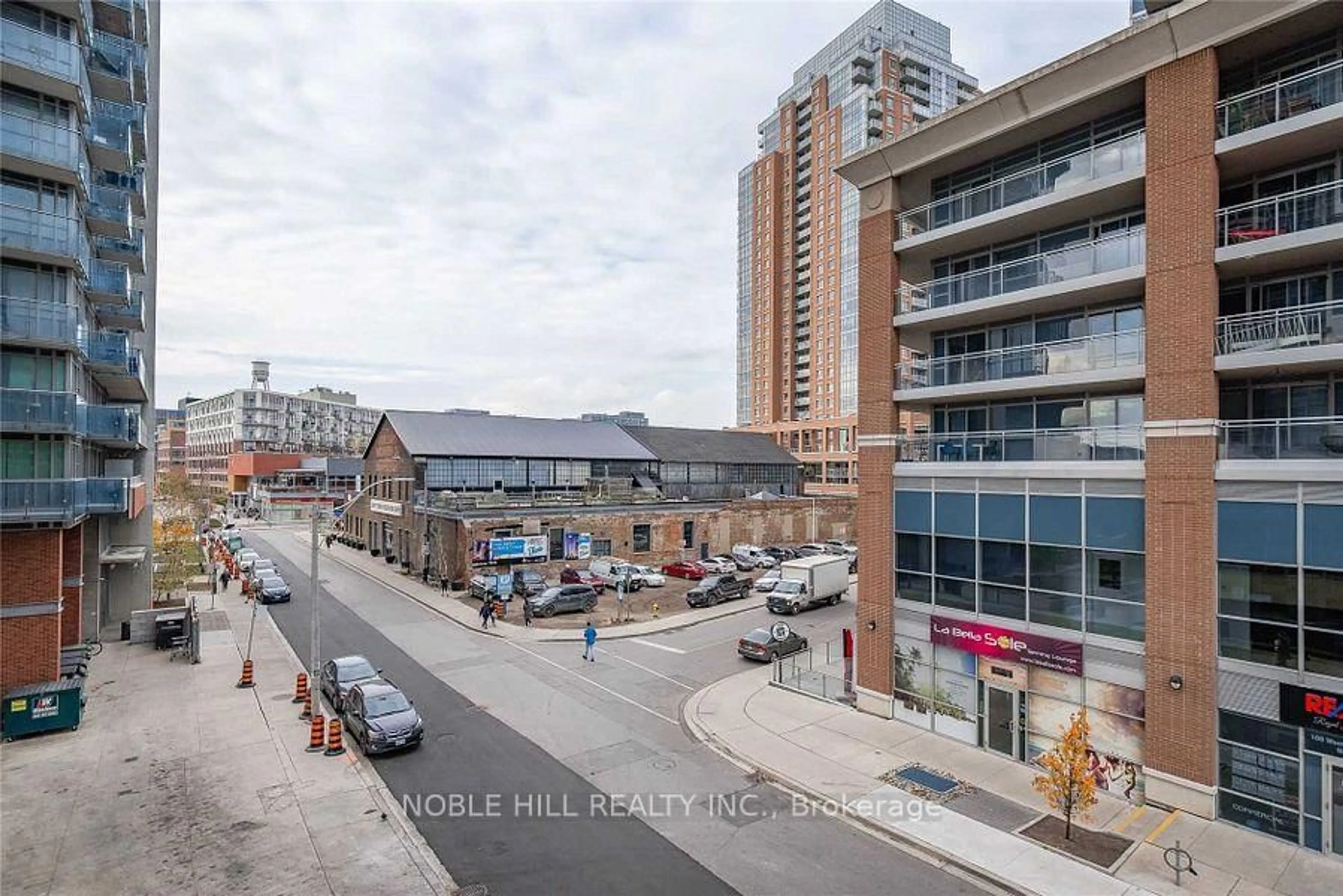 A pic from outside/outdoor area/front of a property/back of a property/a pic from drone, city buildings view from balcony for 69 Lynn Williams St #313, Toronto Ontario M6K 3R7