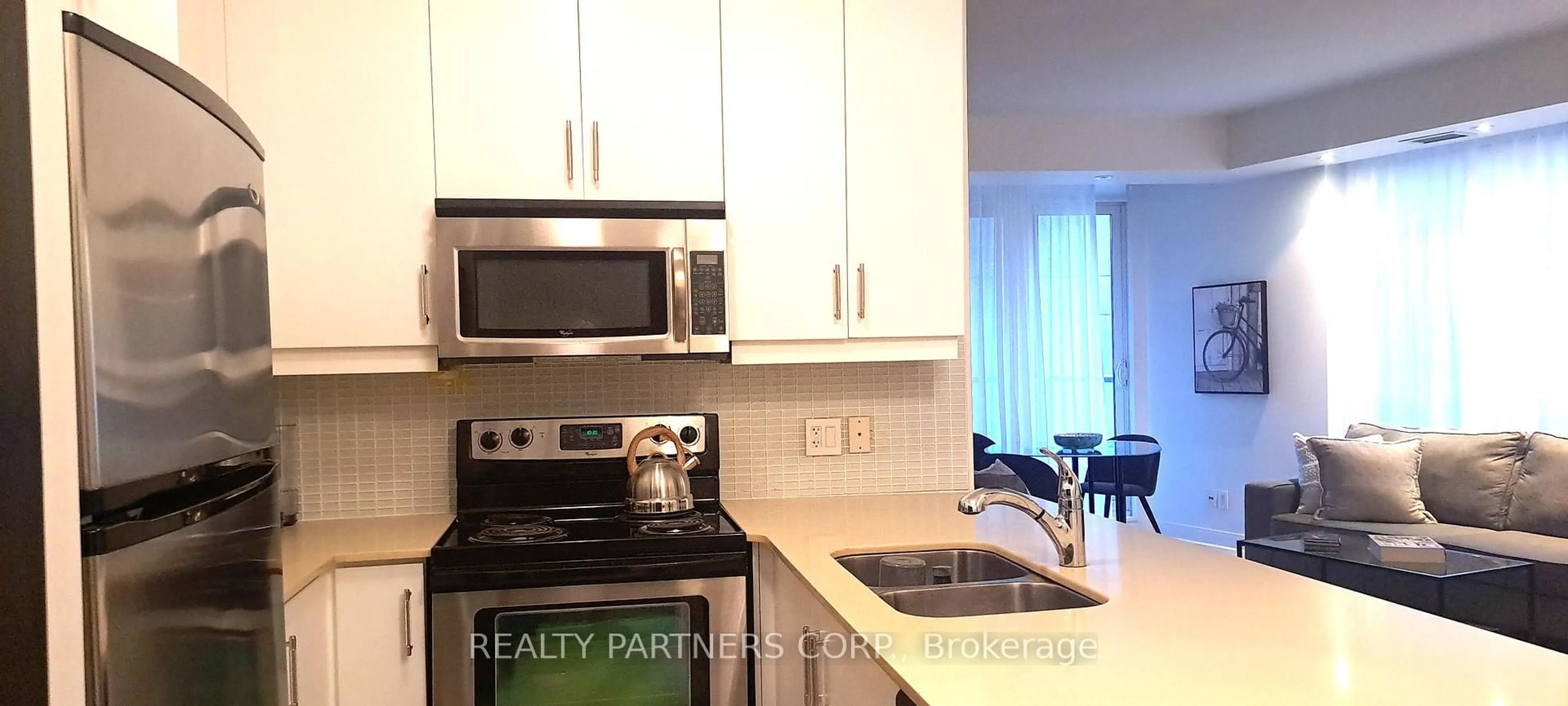 Standard kitchen, wood/laminate floor for 1 Scott St #507, Toronto Ontario M5E 1A1