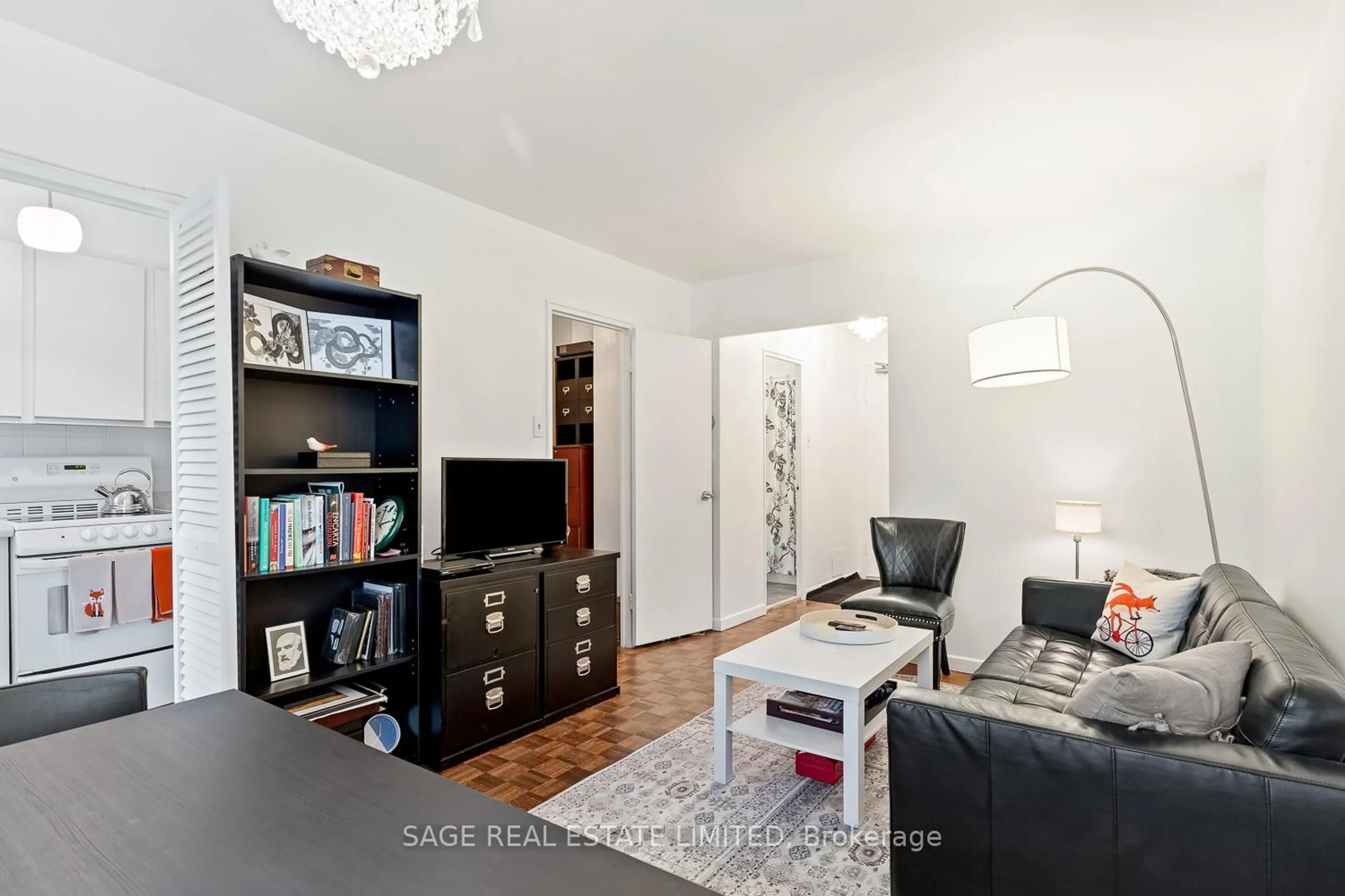 Living room with furniture, wood/laminate floor for 575 Avenue Rd #203, Toronto Ontario M4V 2K2