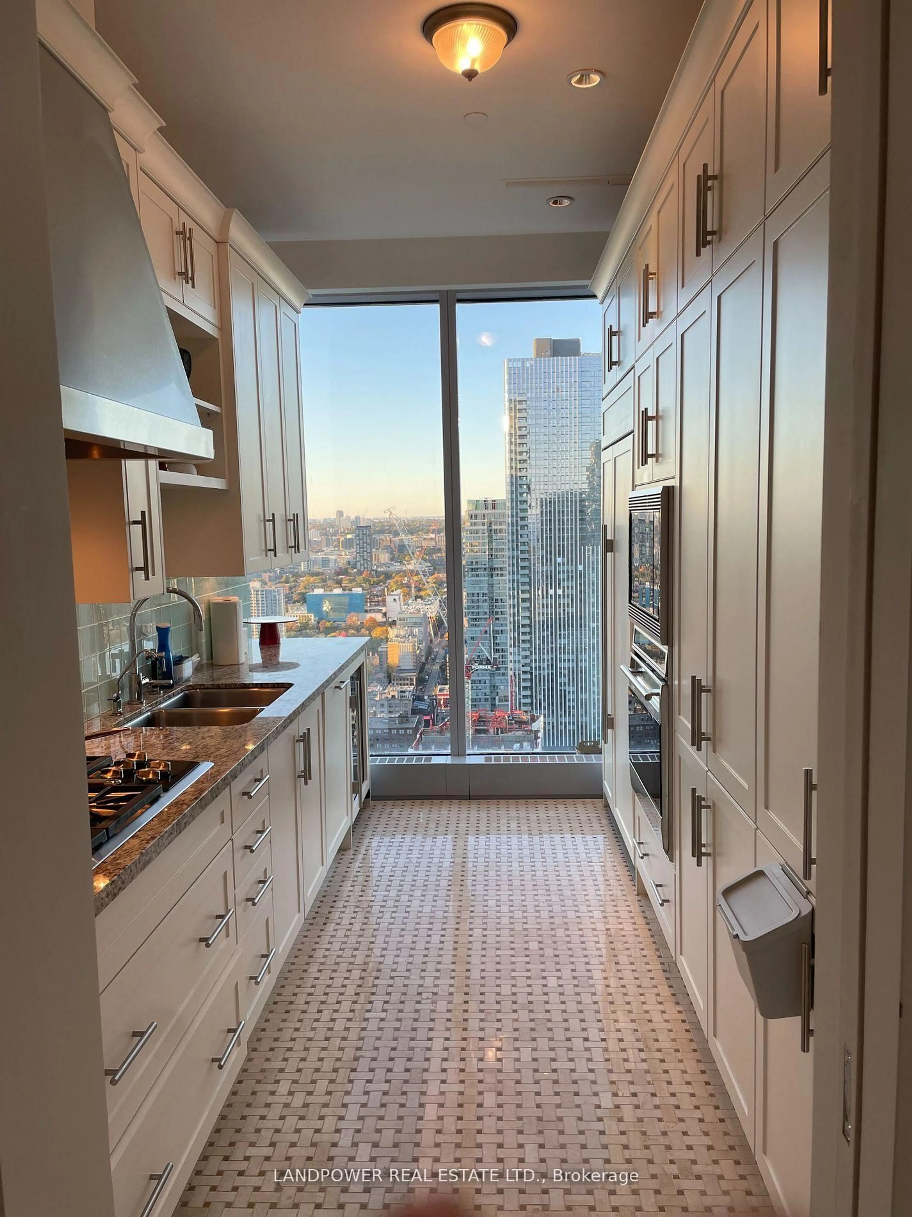 Kitchen with laundary machines, ceramic/tile floor for 183 Wellington St #3702, Toronto Ontario M5V 0A1