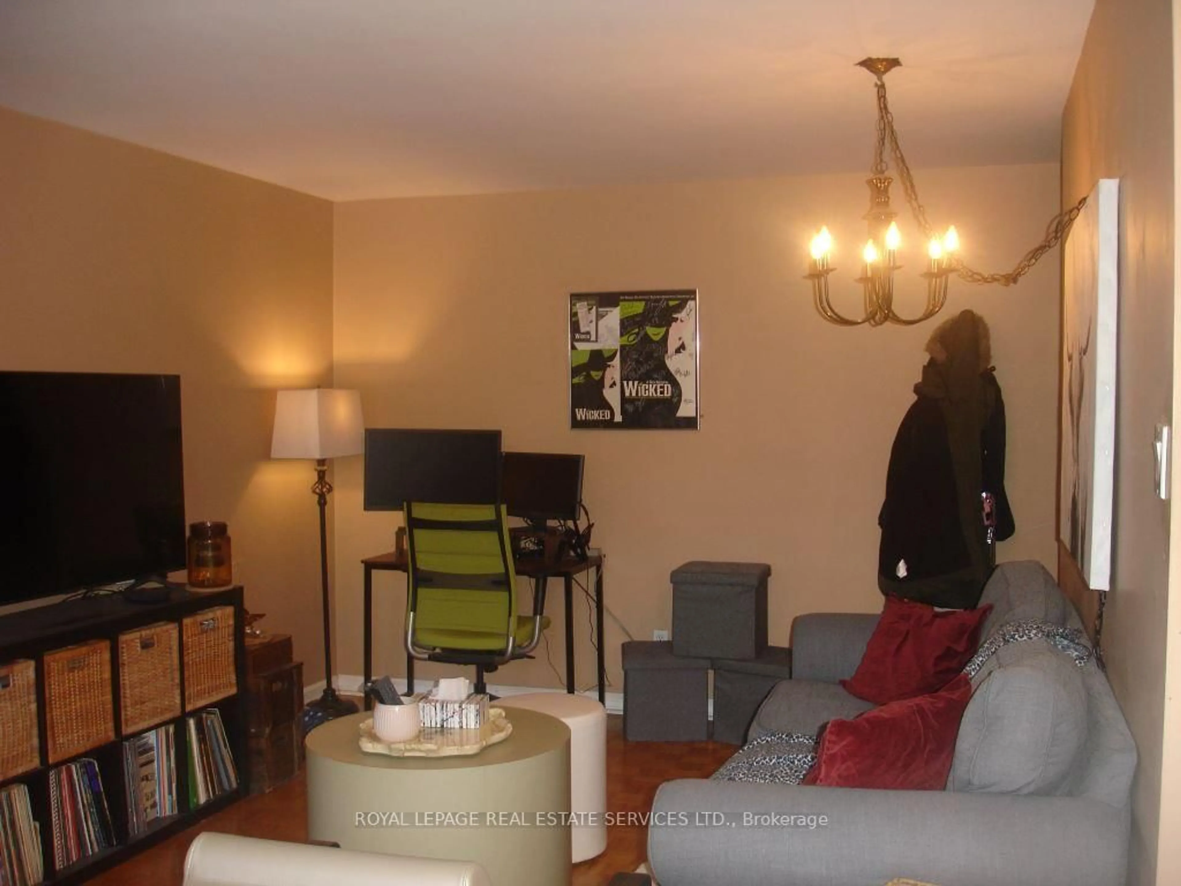 Living room with furniture, wood/laminate floor for 57 Neptune Dr #101, Toronto Ontario M6A 1X2