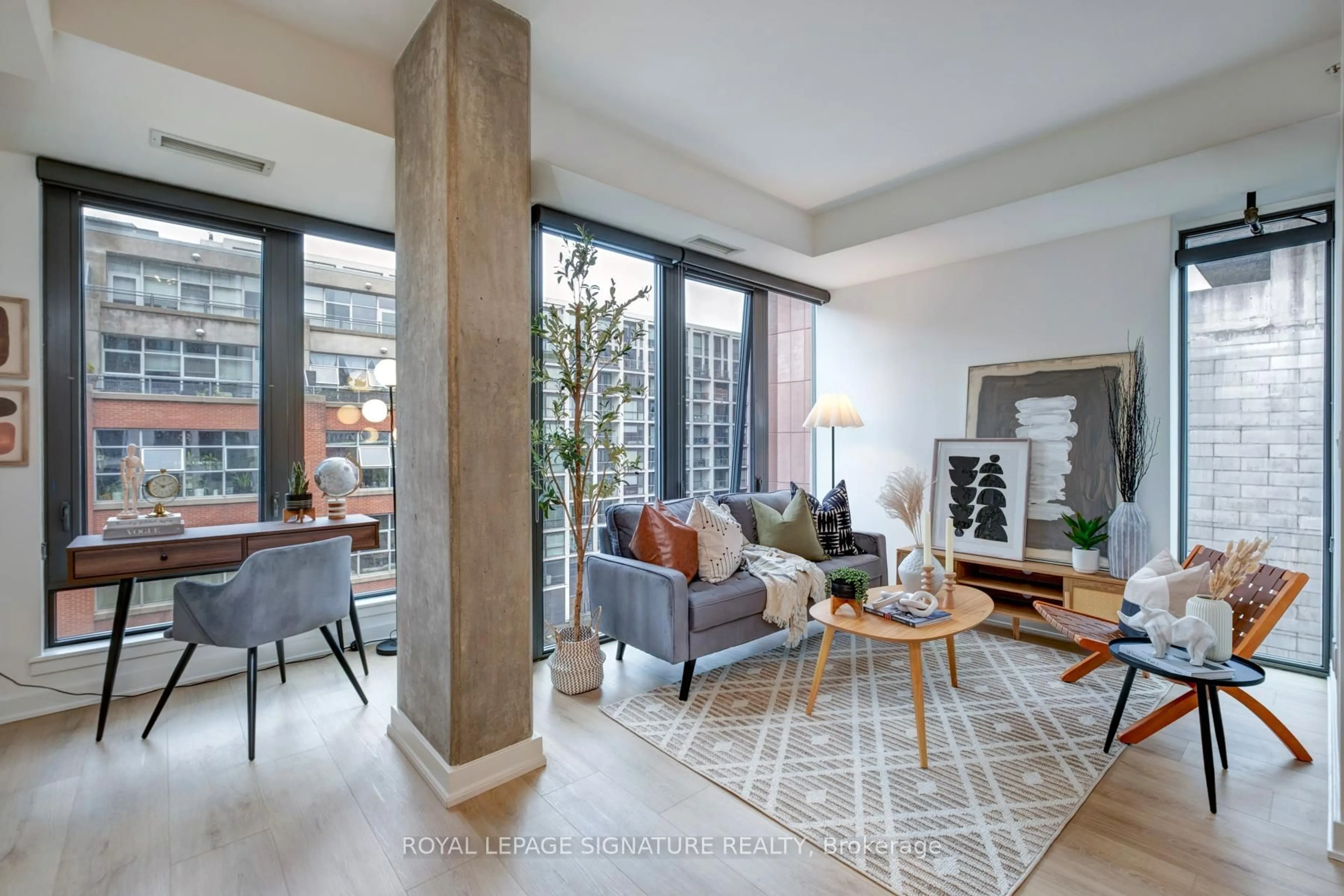 Living room with furniture, cement floor for 32 Camden St #704, Toronto Ontario M5V 0G4