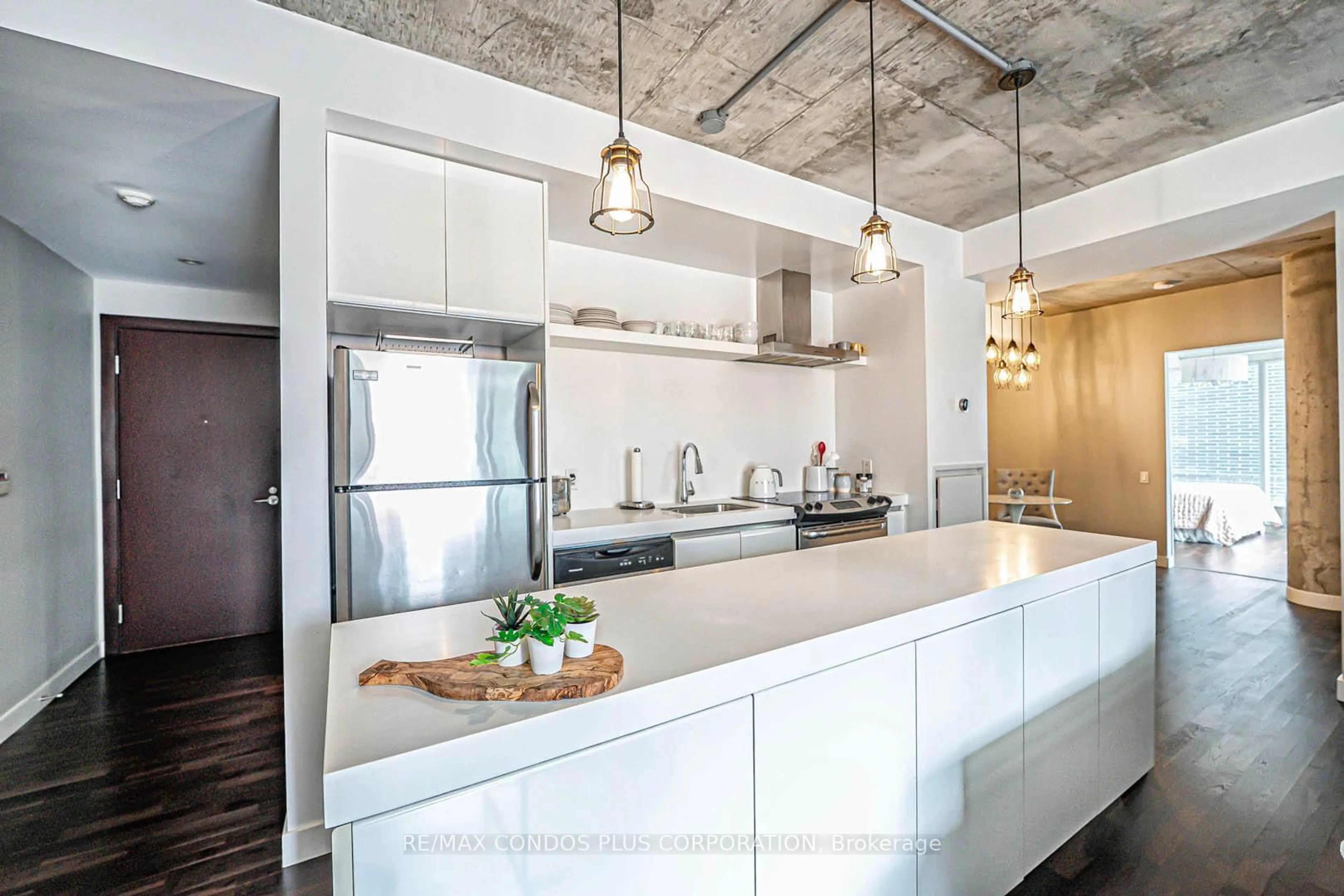 Open concept kitchen, cement floor for 75 Portland St #424, Toronto Ontario M5V 2M9