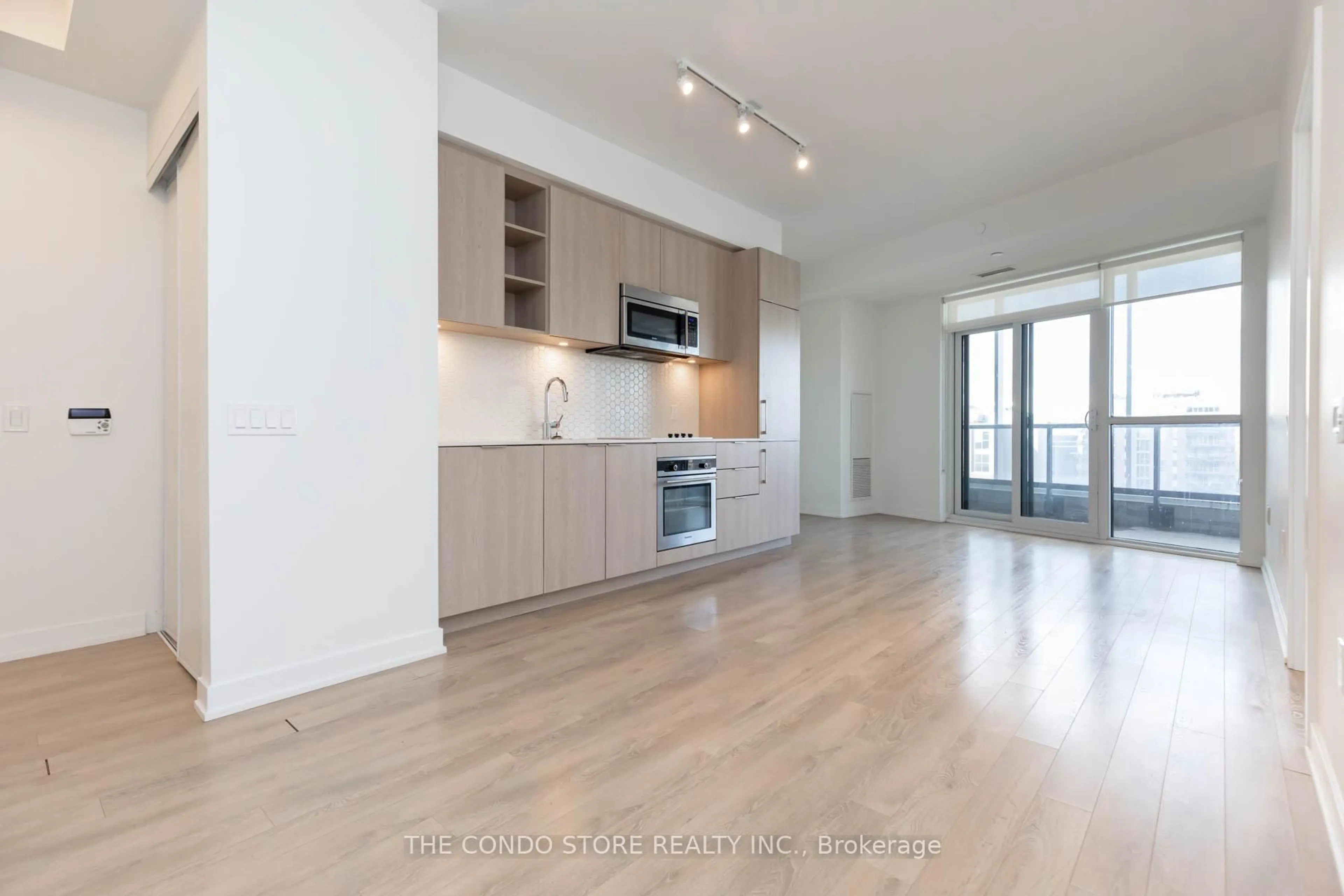 Open concept kitchen, wood/laminate floor for 50 Ordnance St #707, Toronto Ontario M6K 0C9