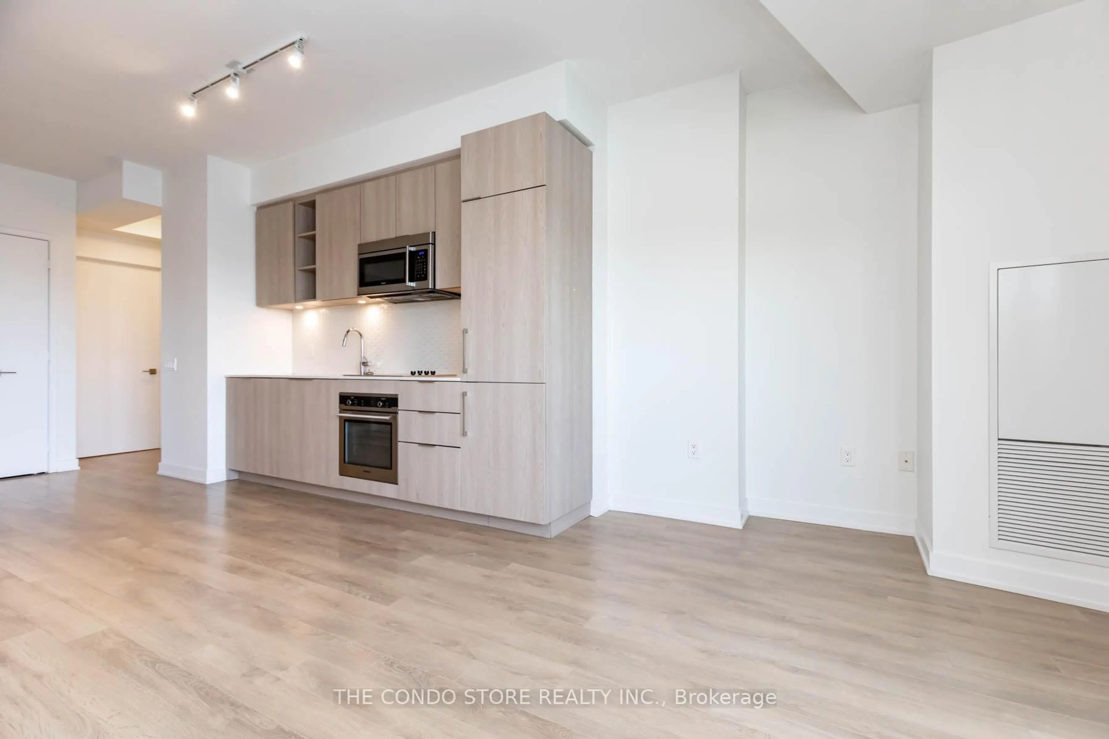 Open concept kitchen, wood/laminate floor for 50 Ordnance St #707, Toronto Ontario M6K 0C9