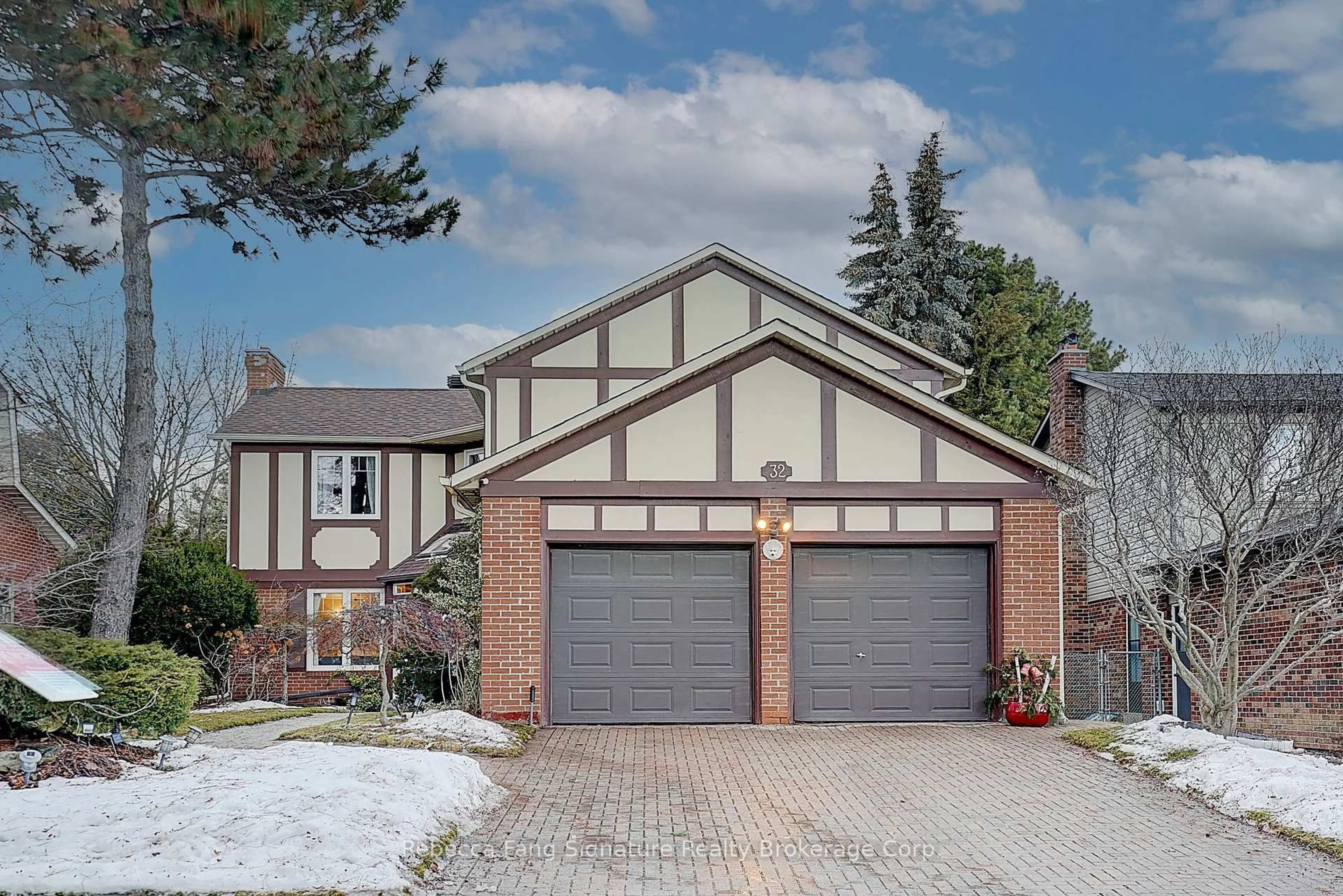 Home with brick exterior material, street for 32 Mossgrove Tr, Toronto Ontario M2L 2W3