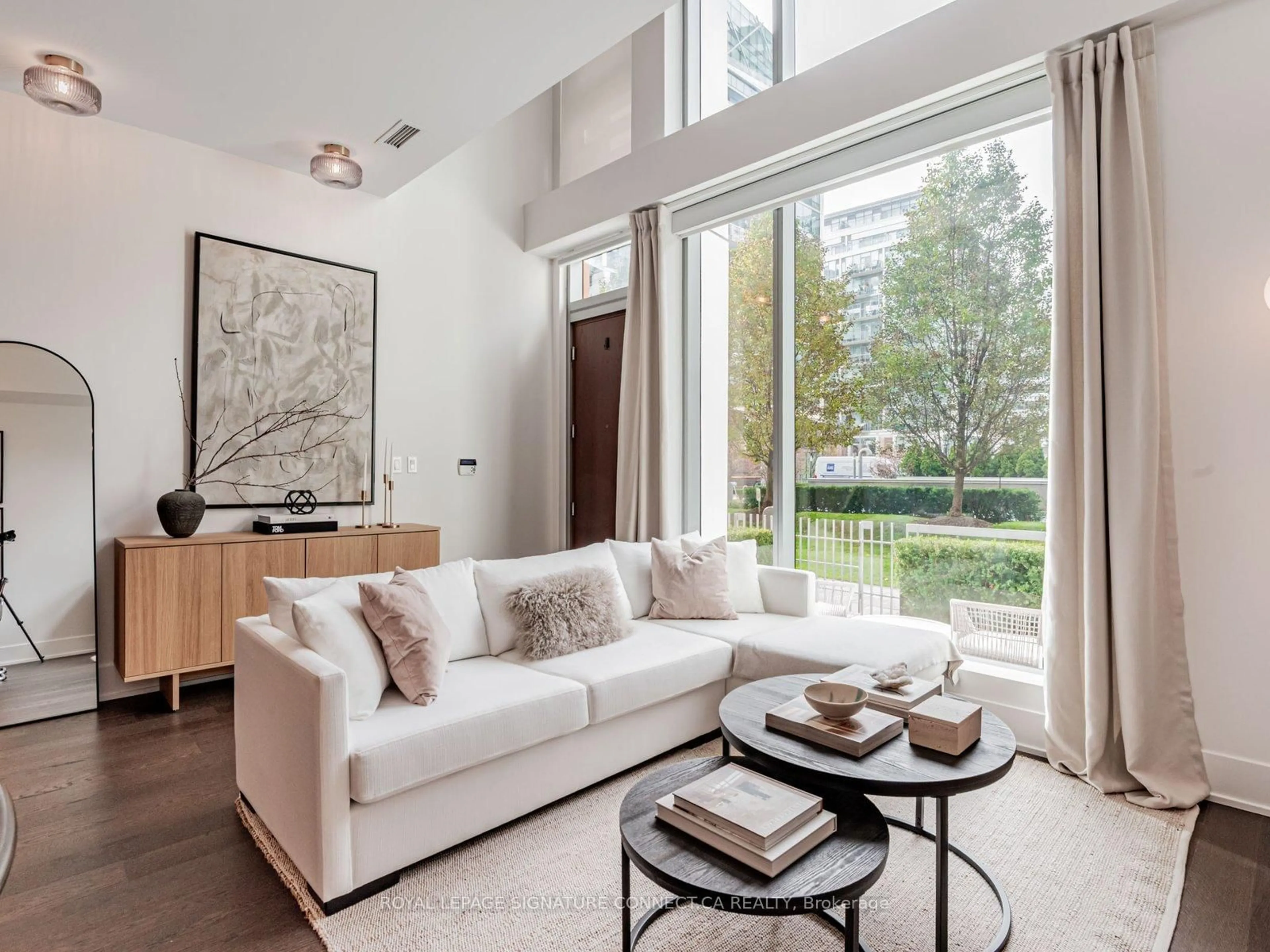 Living room with furniture, unknown for 39 Queens Quay #TH132, Toronto Ontario M5E 0A5