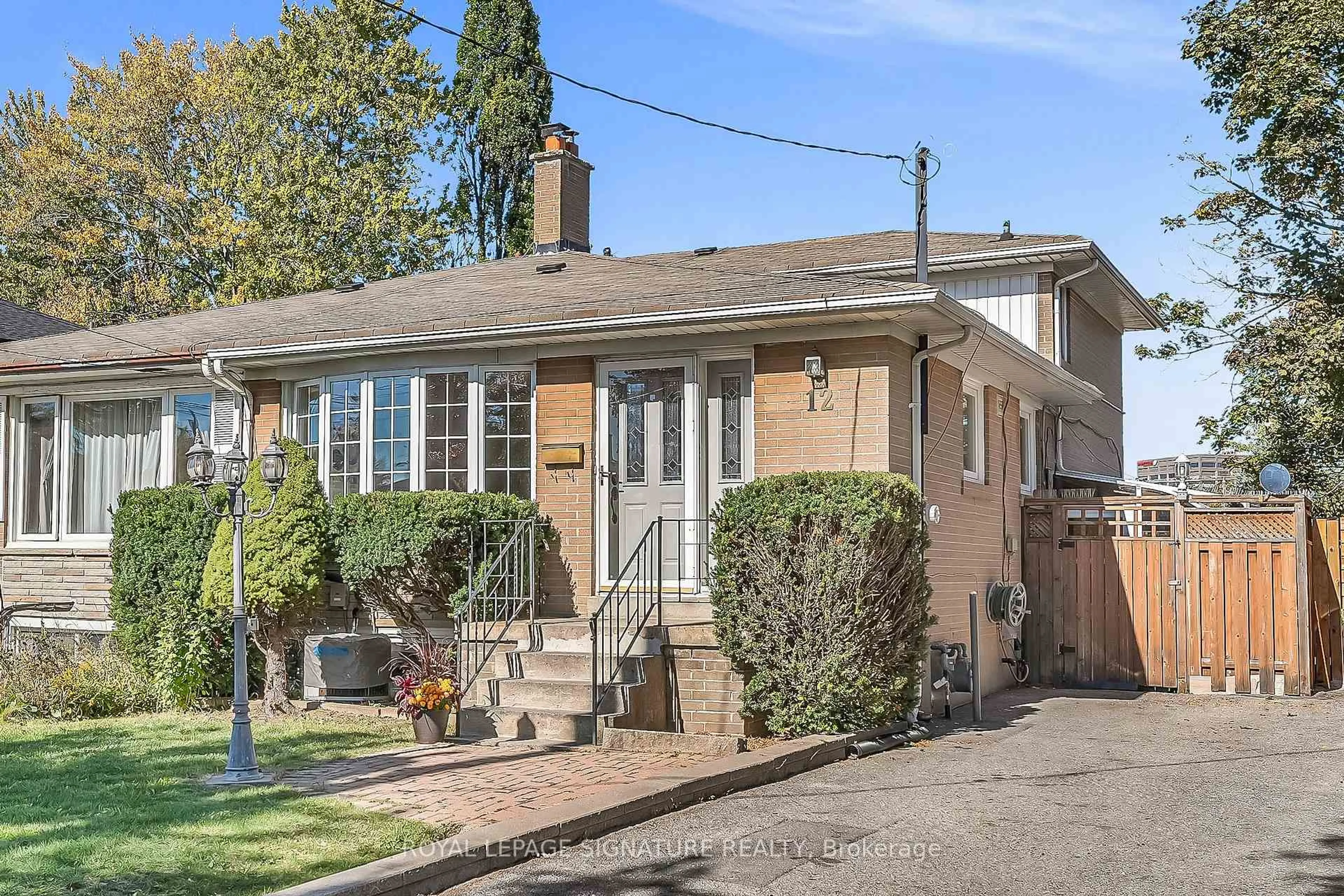 Home with brick exterior material, street for 12 Slidell Cres, Toronto Ontario M3A 2C4
