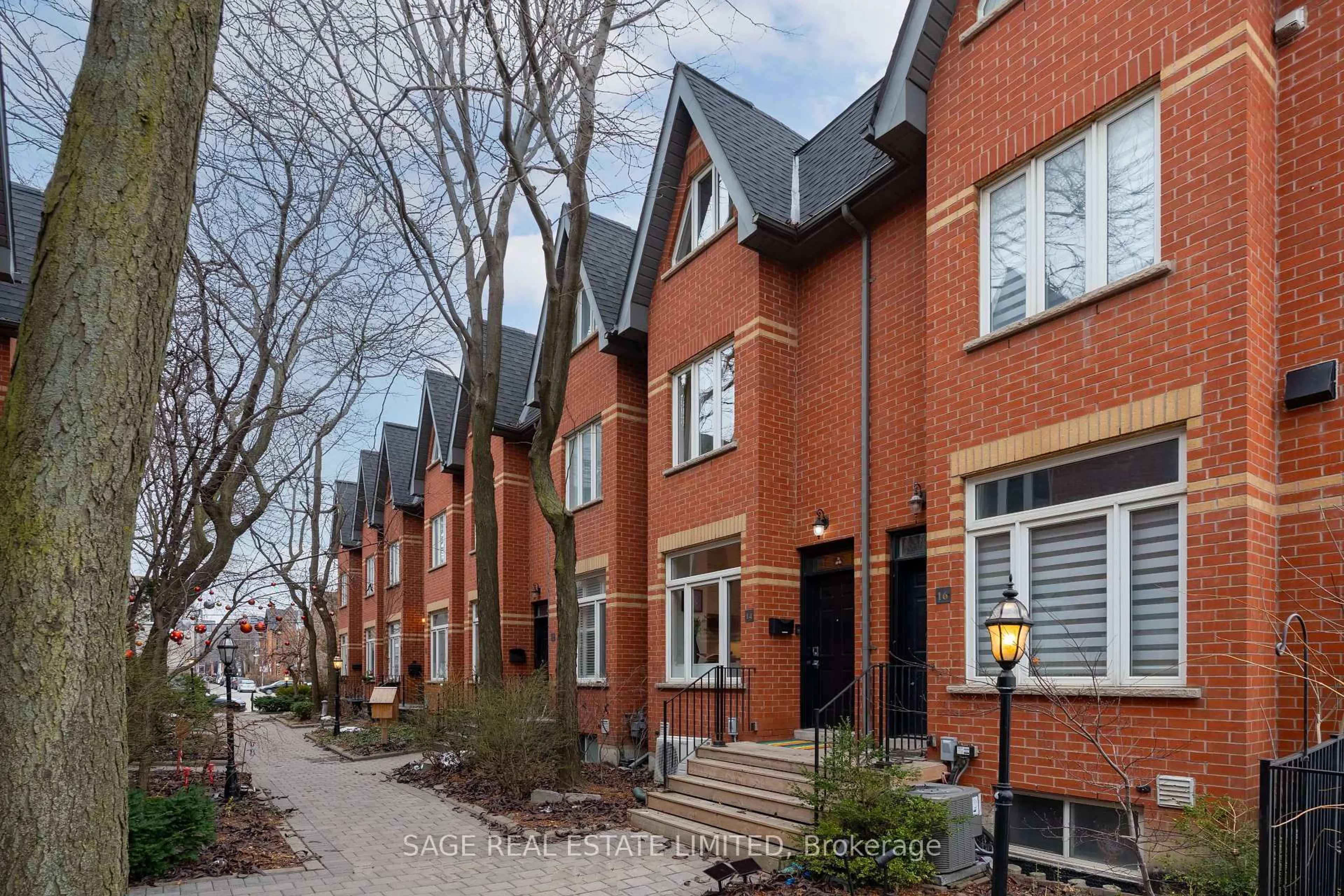 Home with brick exterior material, street for 14 Old Trillium Lane, Toronto Ontario M5A 4T2