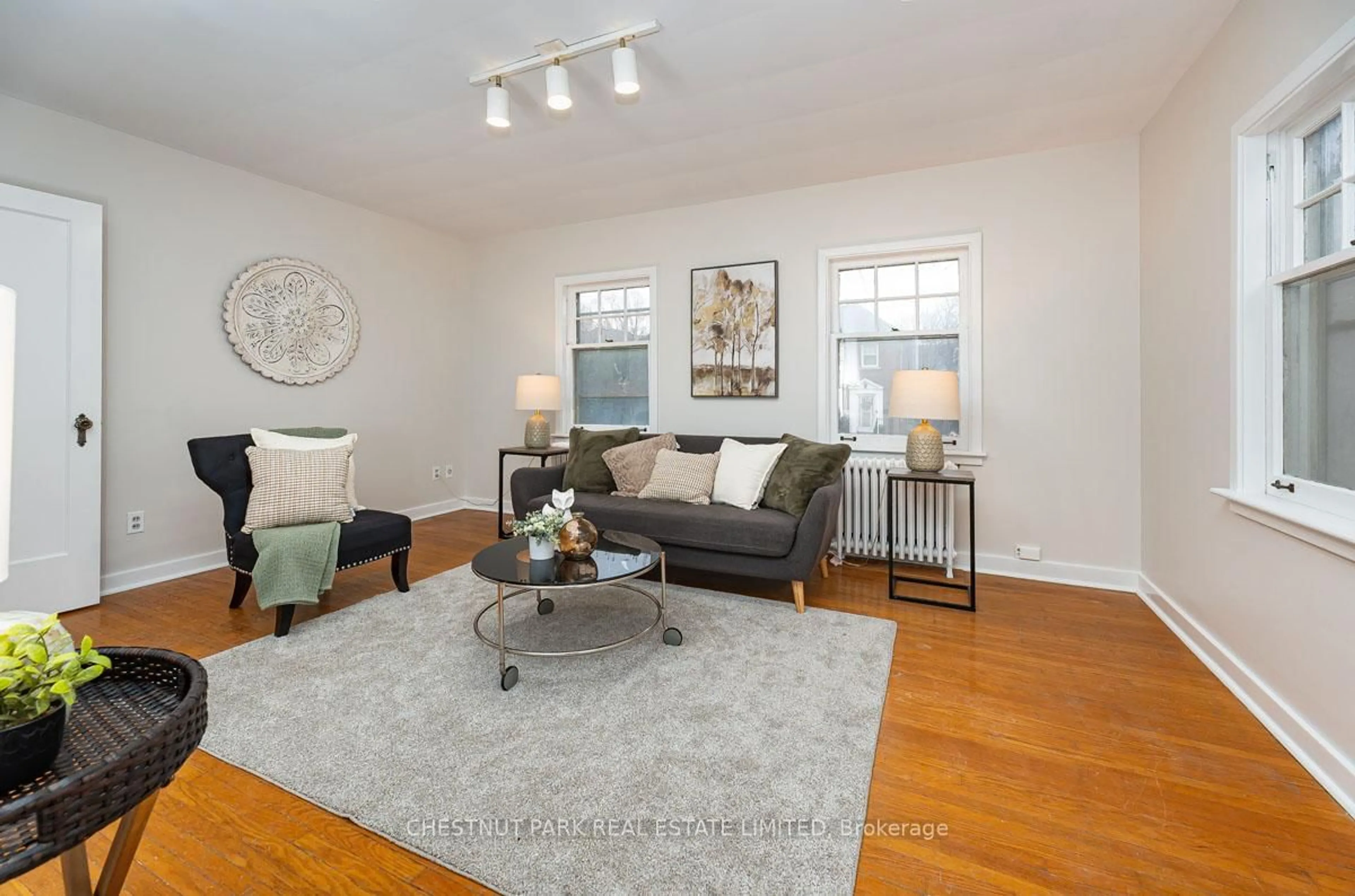 Living room with furniture, wood/laminate floor for 808 Millwood Rd, Toronto Ontario M4G 1W2