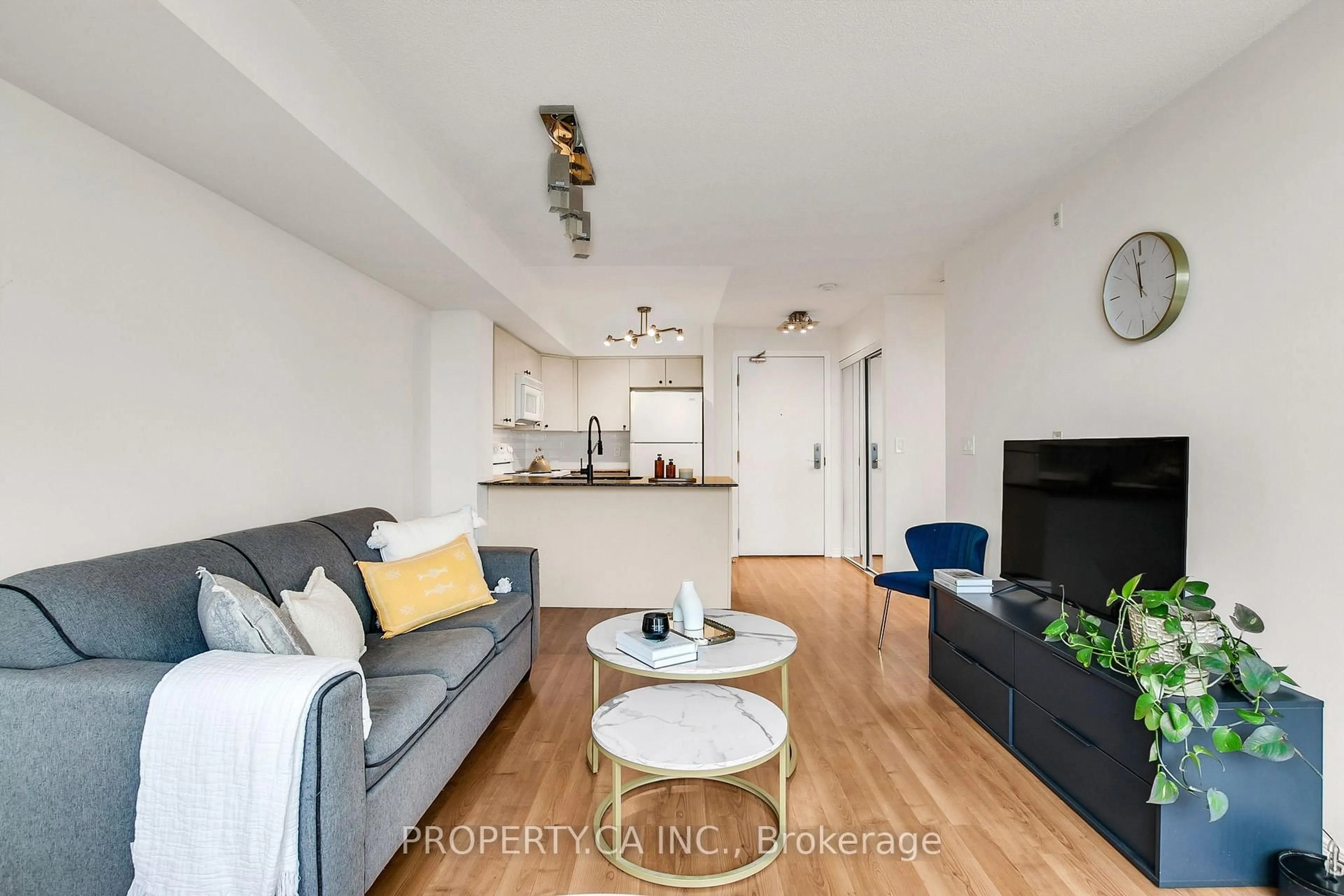 Living room with furniture, wood/laminate floor for 18 Valley Woods Rd #711, Toronto Ontario M3A 0A1