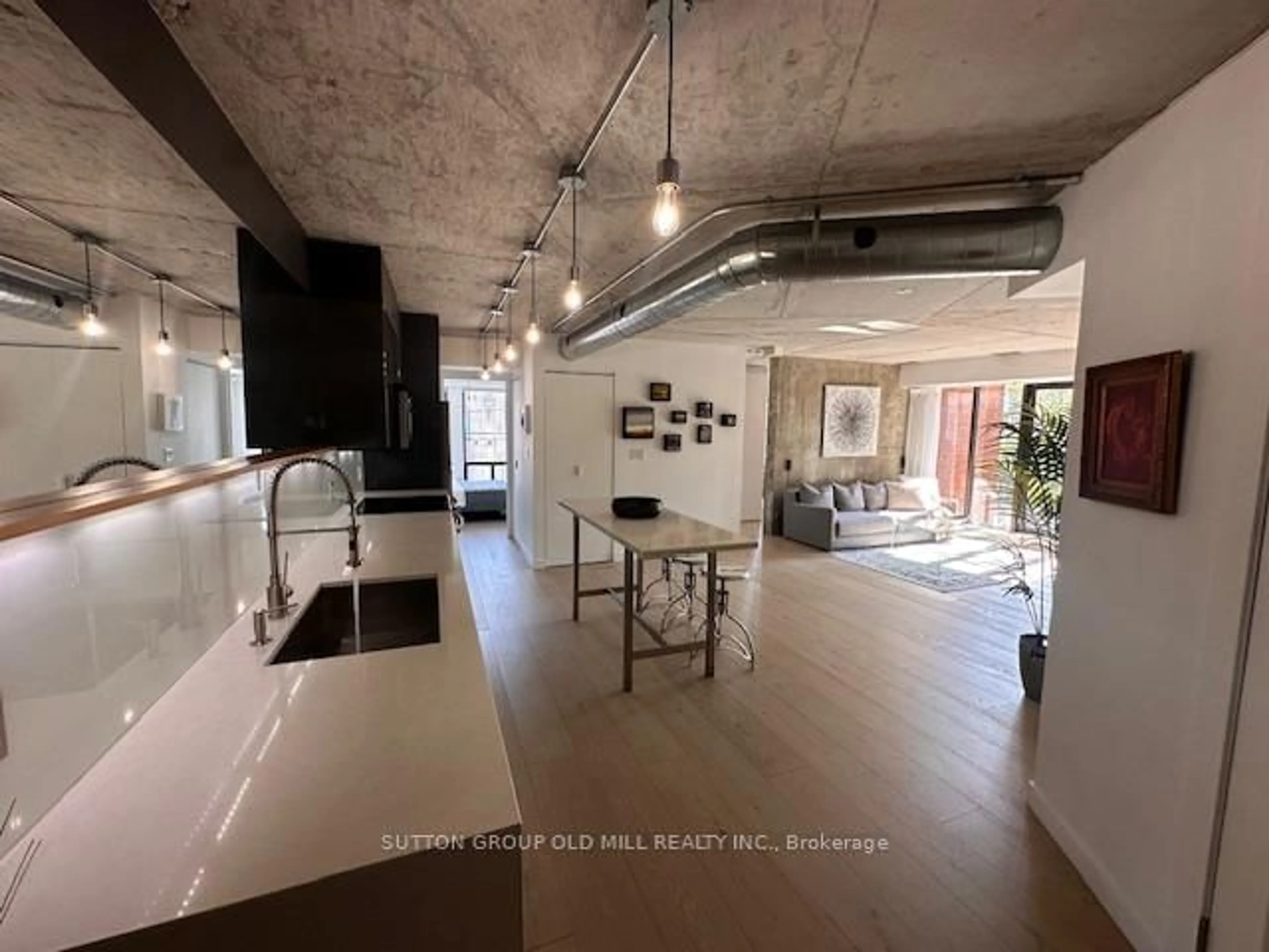 Open concept kitchen, cement floor for 456 College St #211, Toronto Ontario M6G 4A3