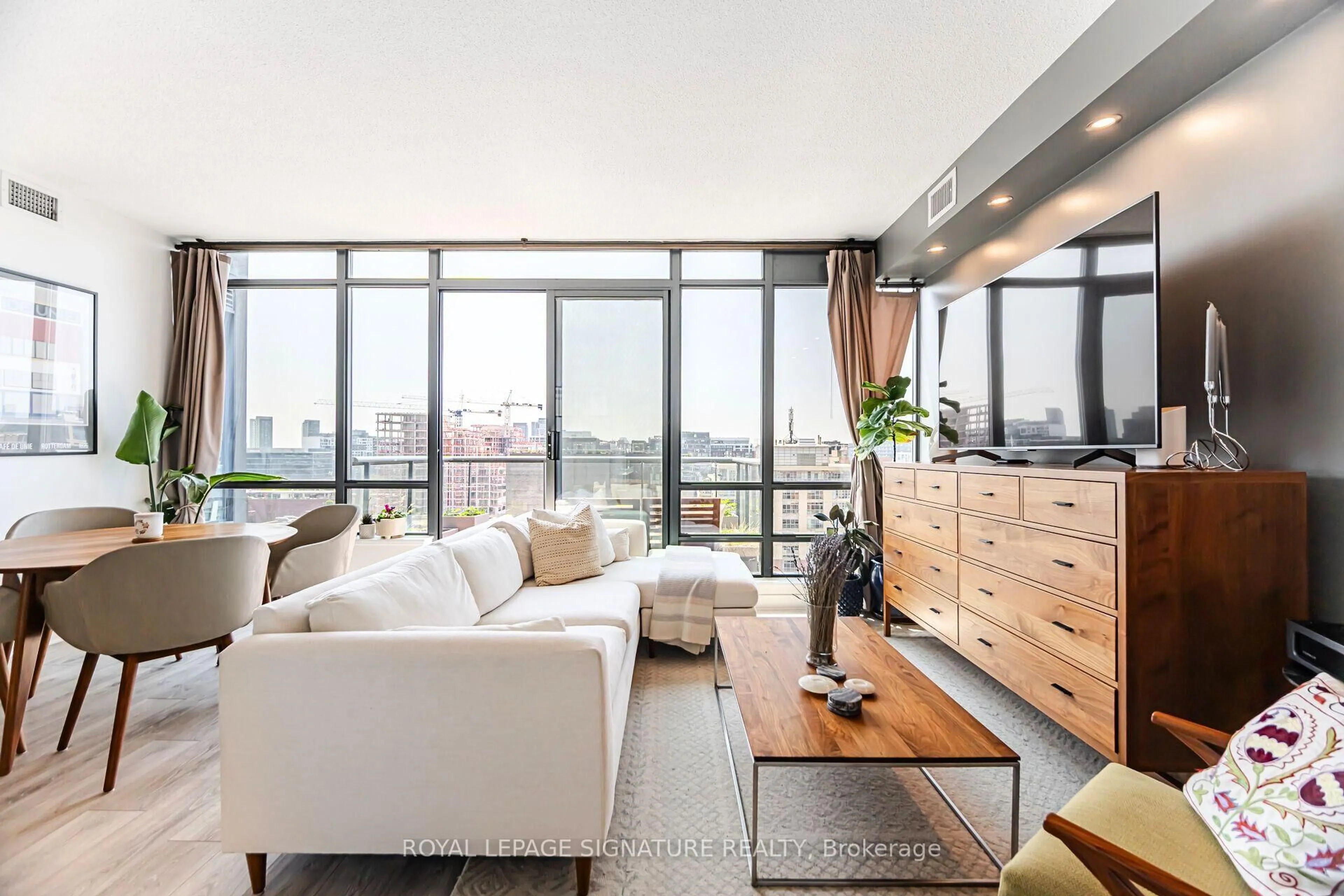 Living room with furniture, wood/laminate floor for 438 King St #1405, Toronto Ontario M5V 3T9