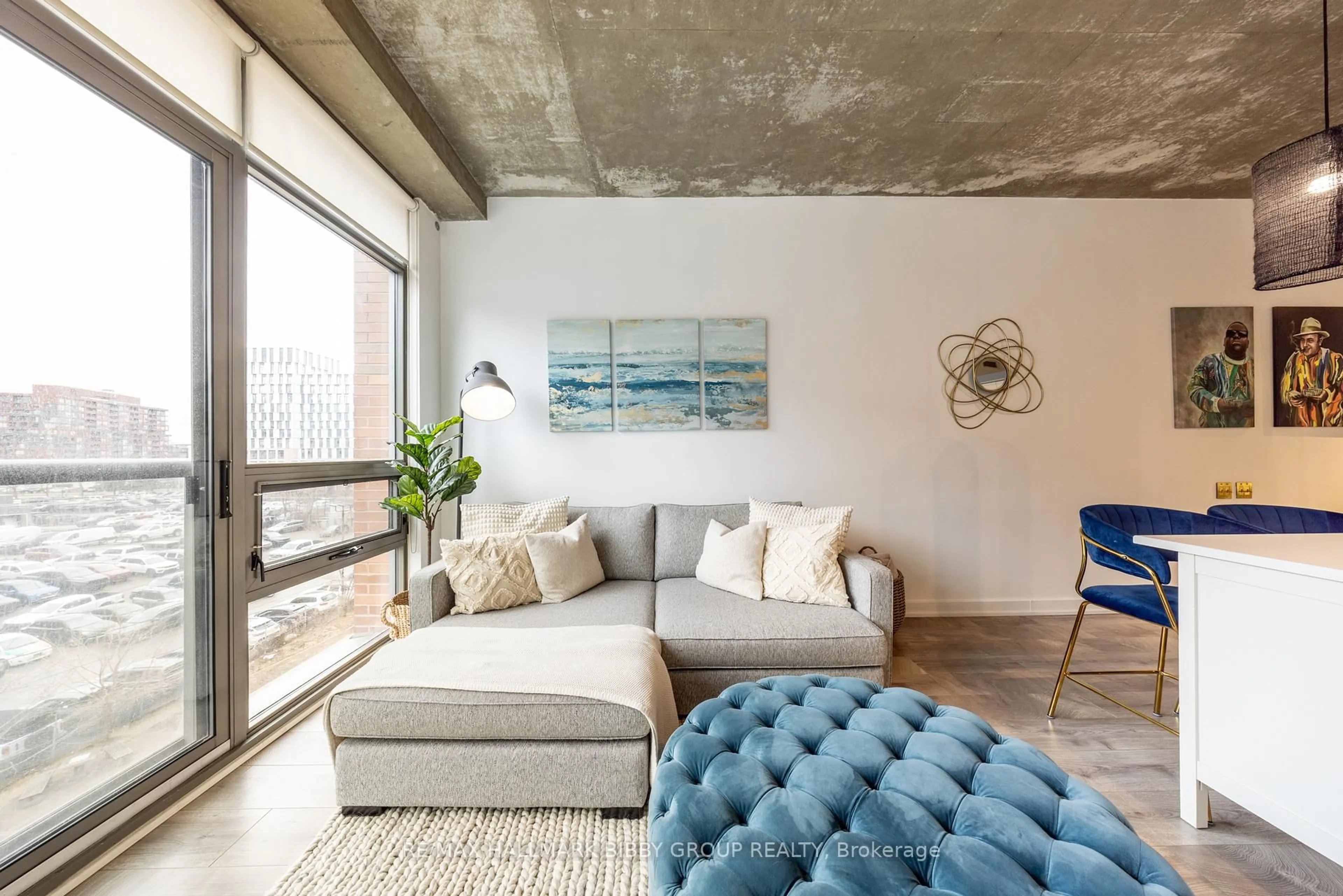 Living room with furniture, cement floor for 33 Mill St #447, Toronto Ontario M5A 3R3
