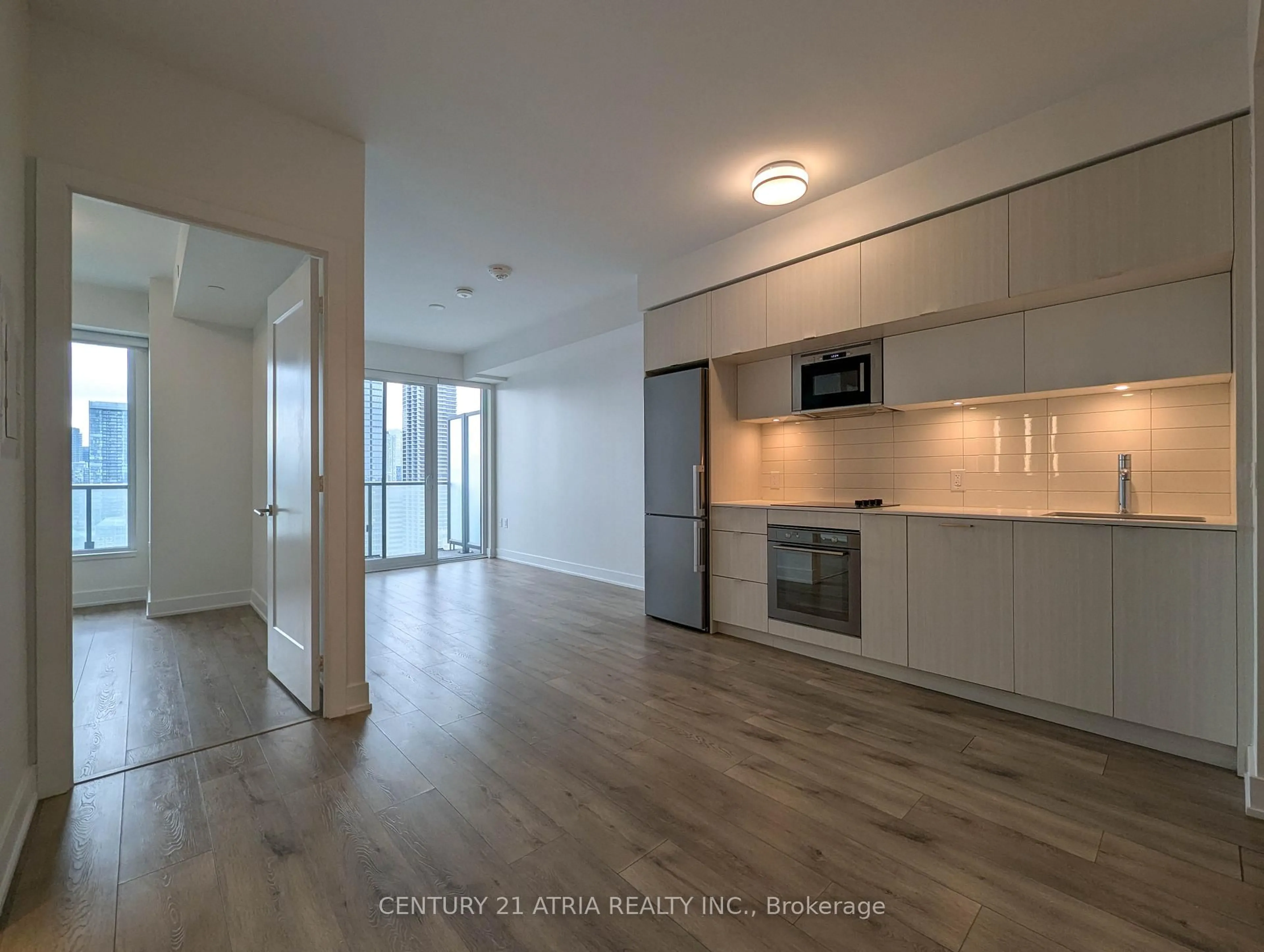 Open concept kitchen, wood/laminate floor for 575 Bloor St #3001, Toronto Ontario M4W 0B2