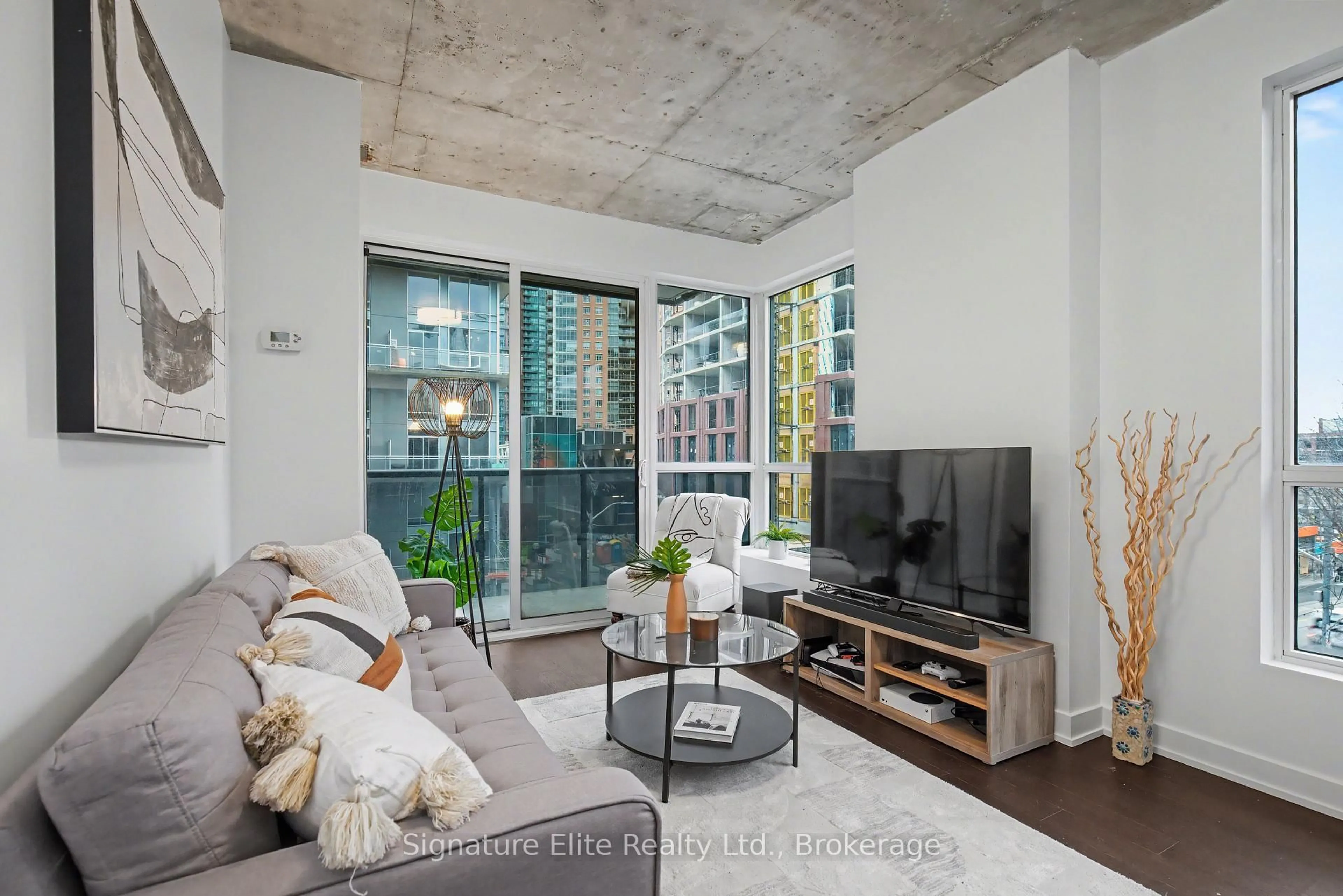 Living room with furniture, cement floor for 1030 King St #342, Toronto Ontario M6K 0B4