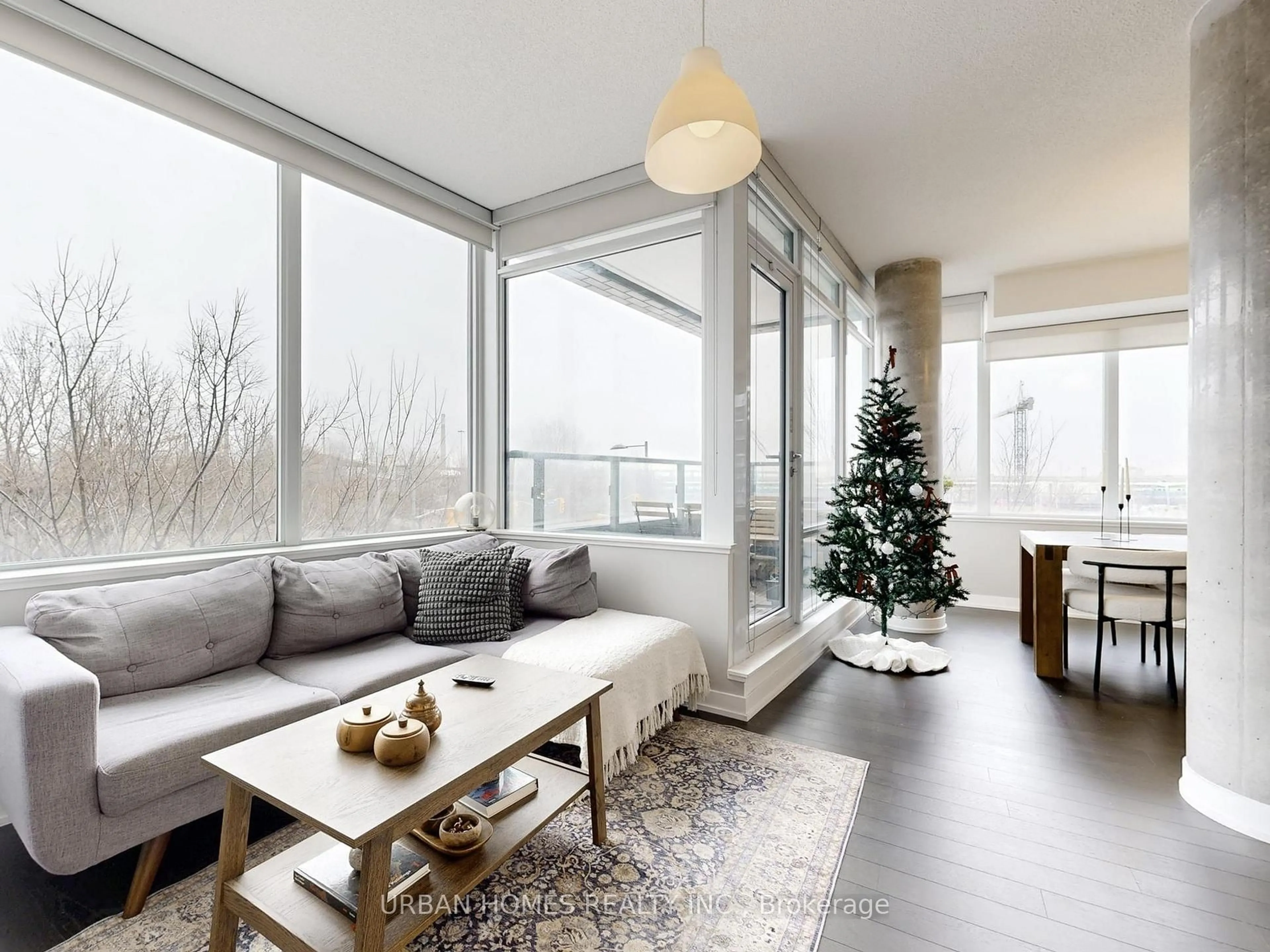 Living room with furniture, wood/laminate floor for 120 Bayview Ave #S202, Toronto Ontario M5A 3R7