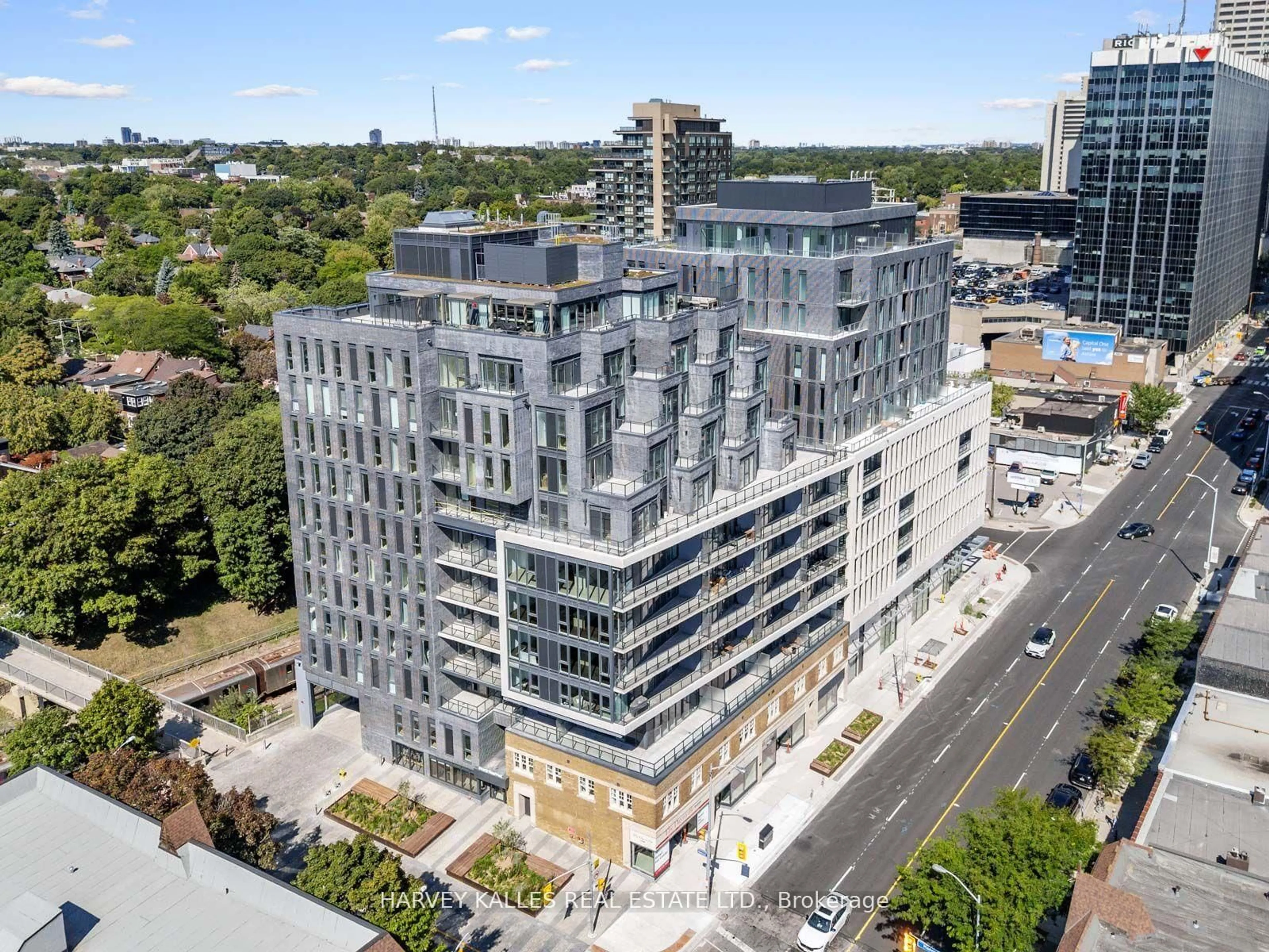 A pic from outside/outdoor area/front of a property/back of a property/a pic from drone, city buildings view from balcony for 8 Manor Rd #410, Toronto Ontario M4S 2A5