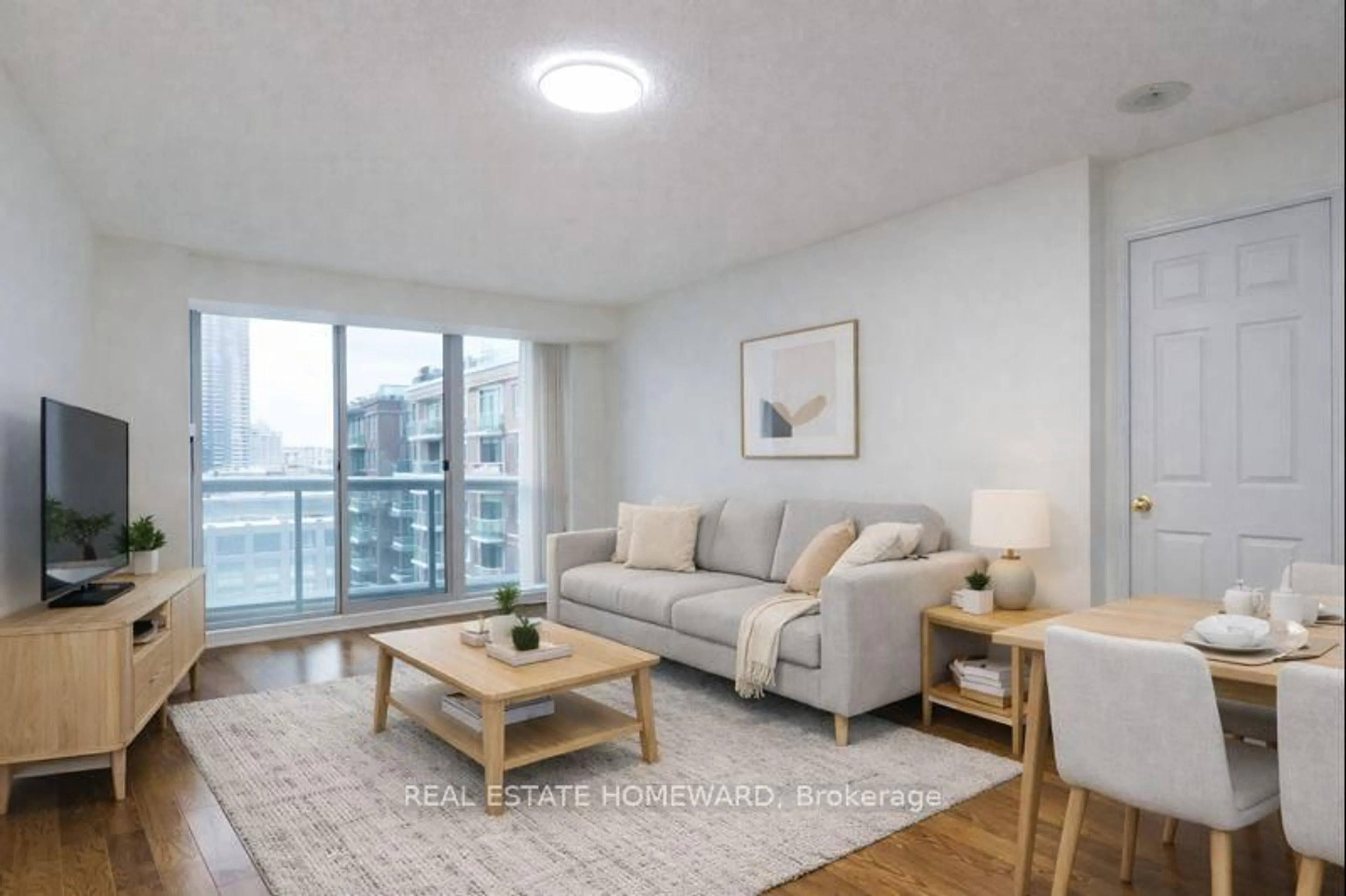 Living room with furniture, wood/laminate floor for 109 Front St #1111, Toronto Ontario M5A 4P7