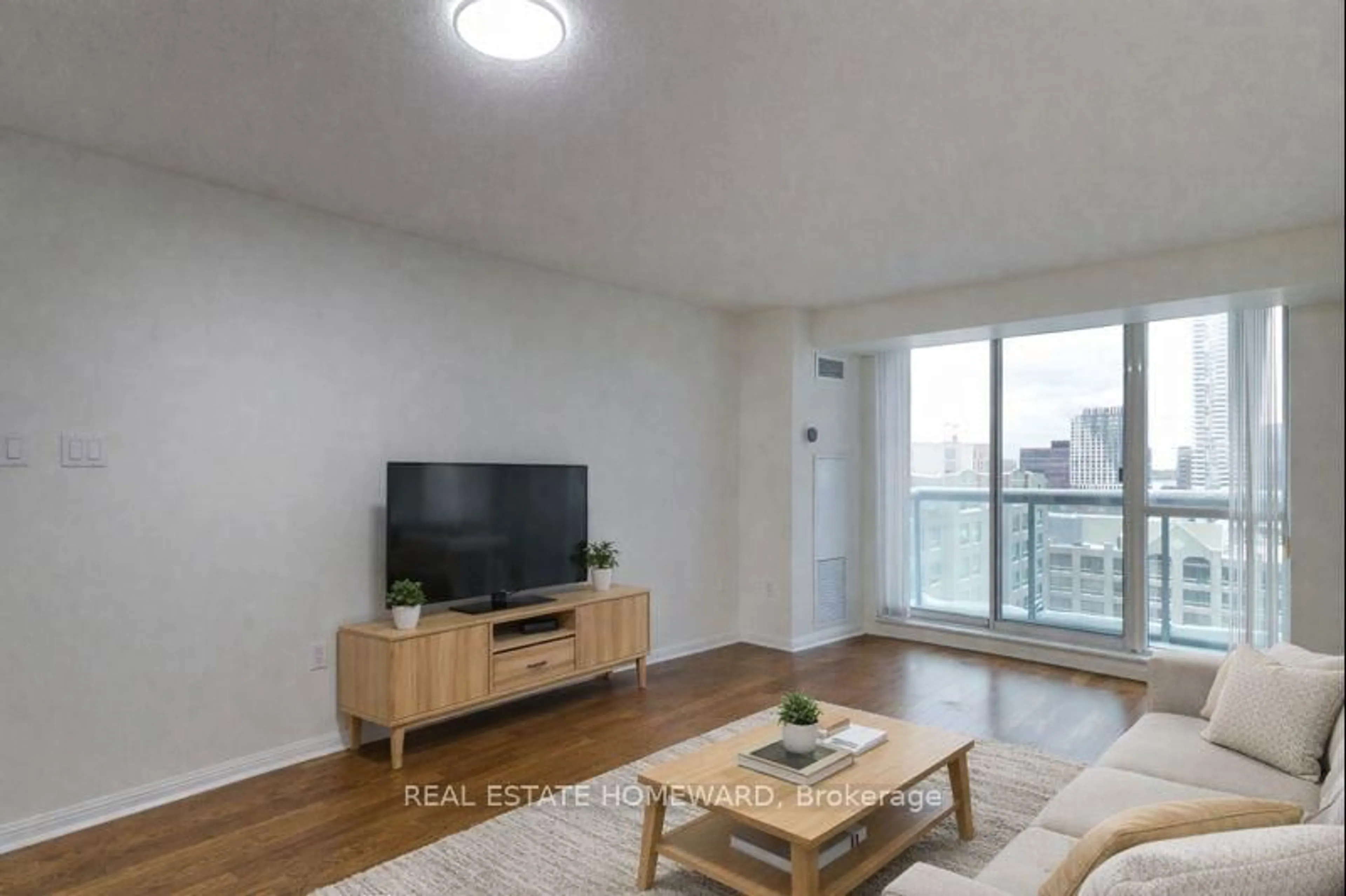 Living room with furniture, wood/laminate floor for 109 Front St #1111, Toronto Ontario M5A 4P7