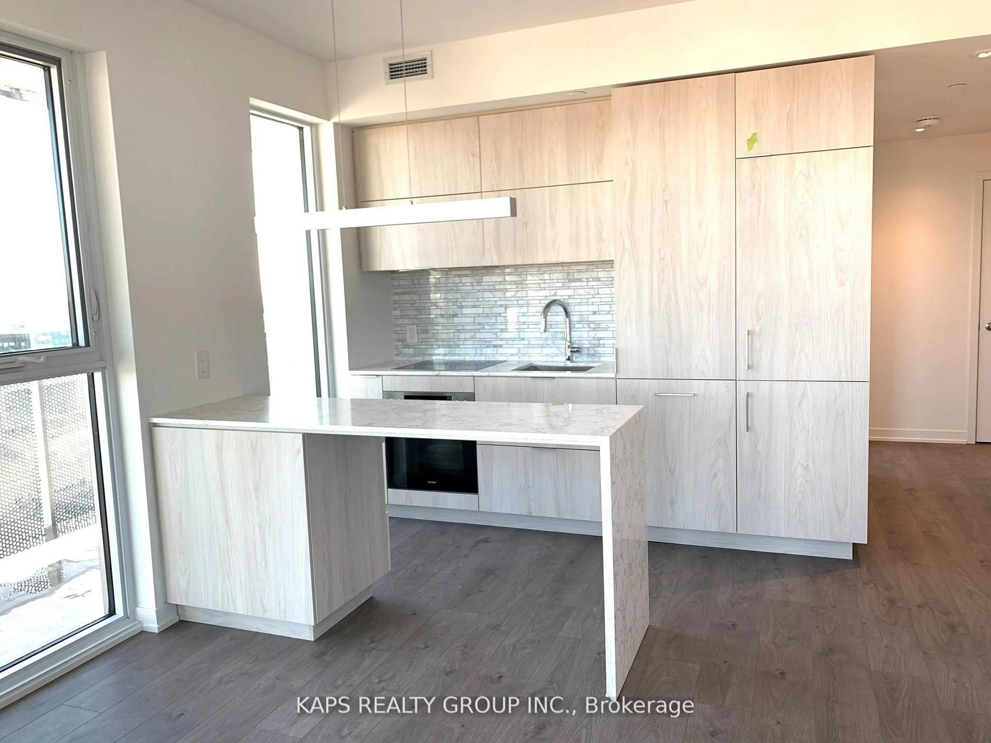 Open concept kitchen, wood/laminate floor for 20 Richardson St #1710, Toronto Ontario M5A 0S6