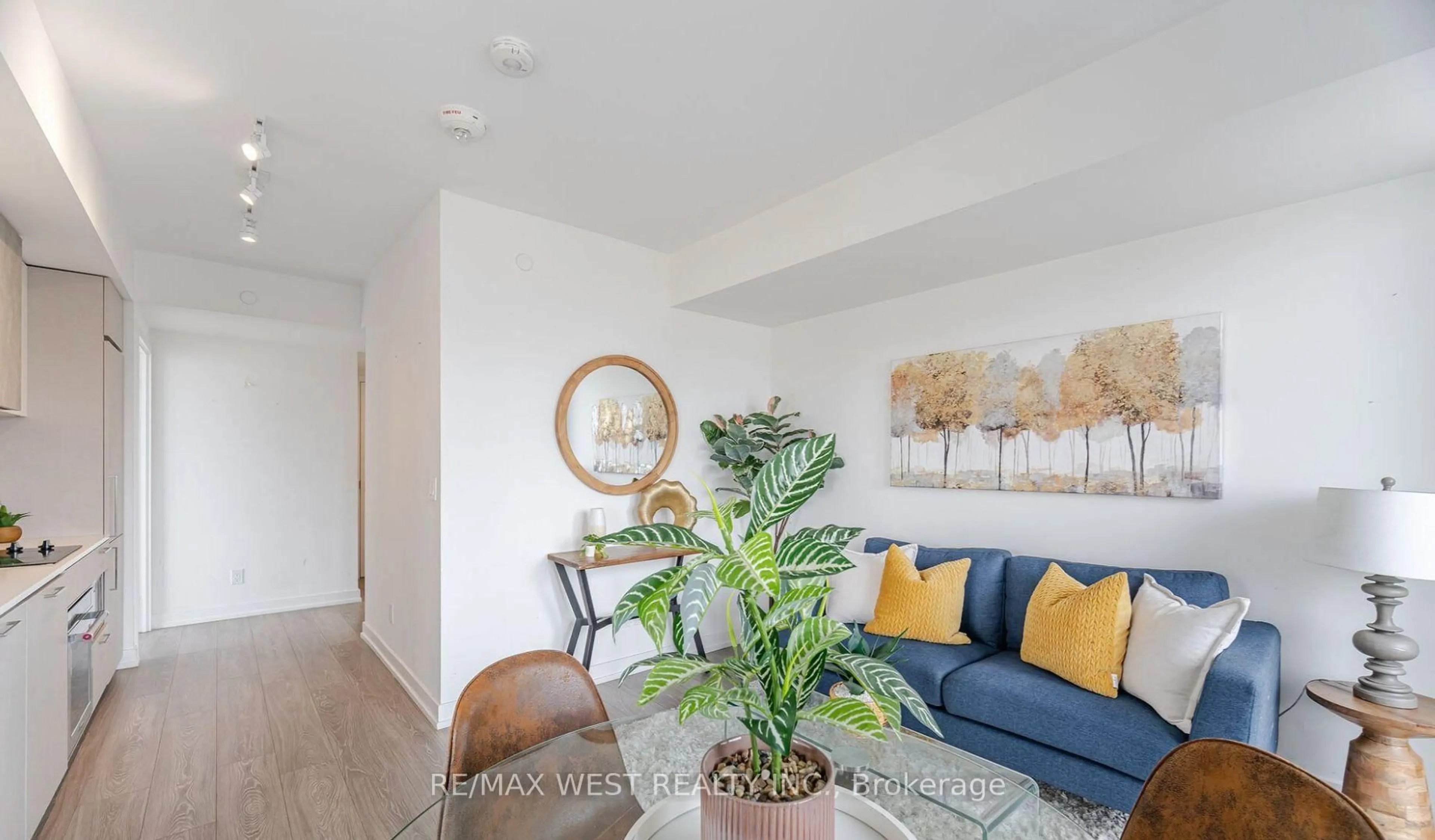 Living room with furniture, wood/laminate floor for 19 Western Battery Rd #2117, Toronto Ontario M6K 0E3