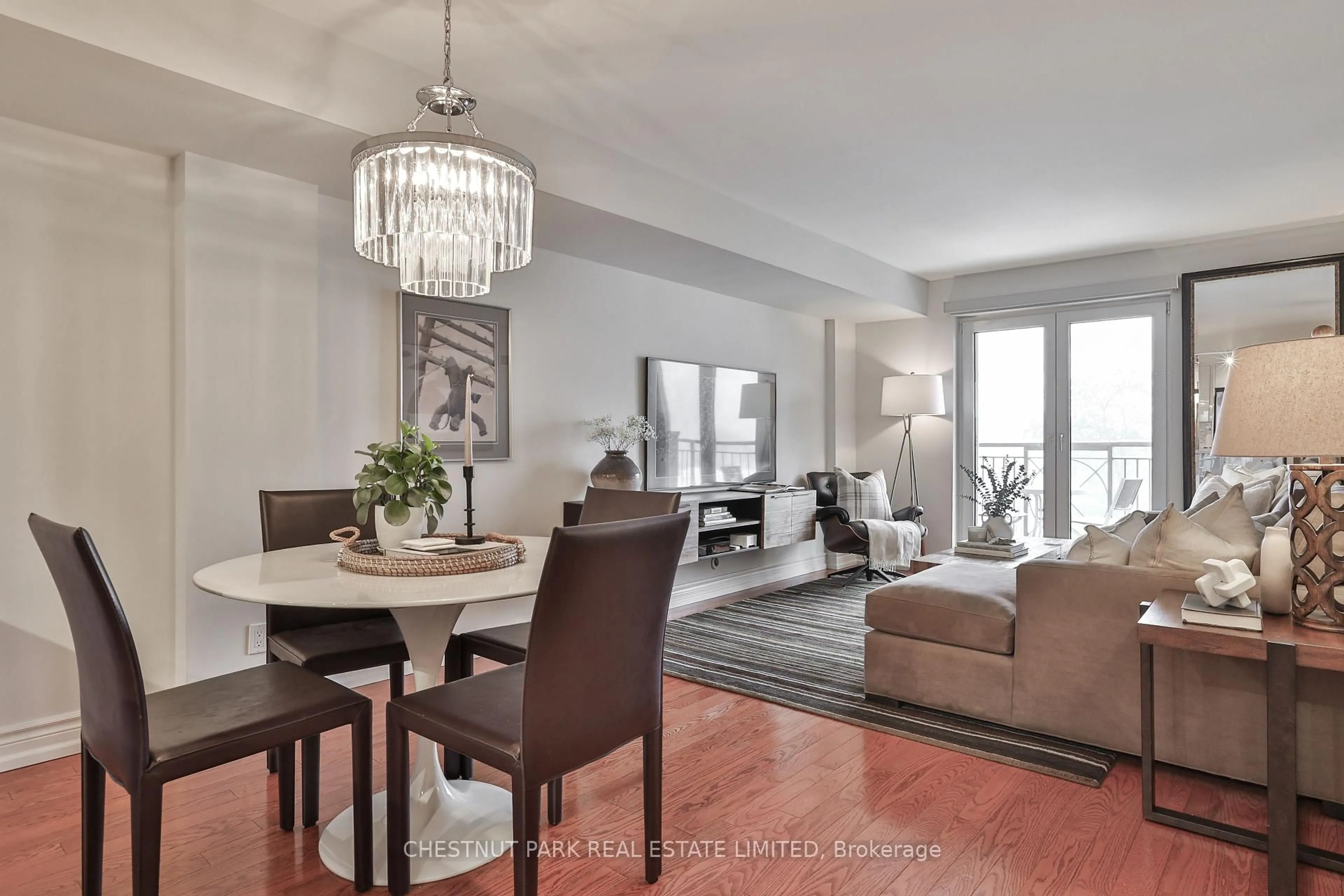 Living room with furniture, wood/laminate floor for 1 Balmoral Ave #716, Toronto Ontario M4V 3B9